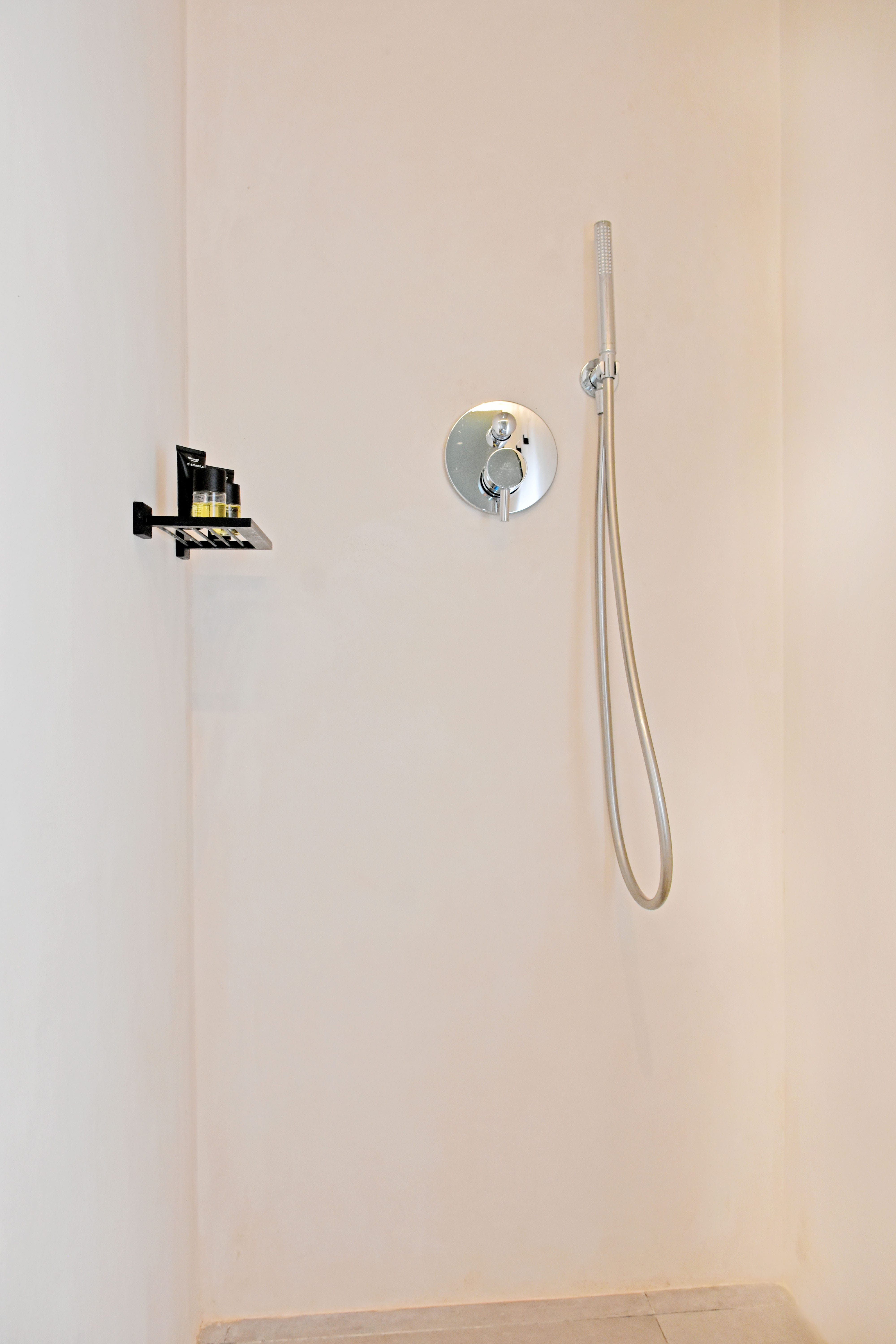 a shower head in a bathroom