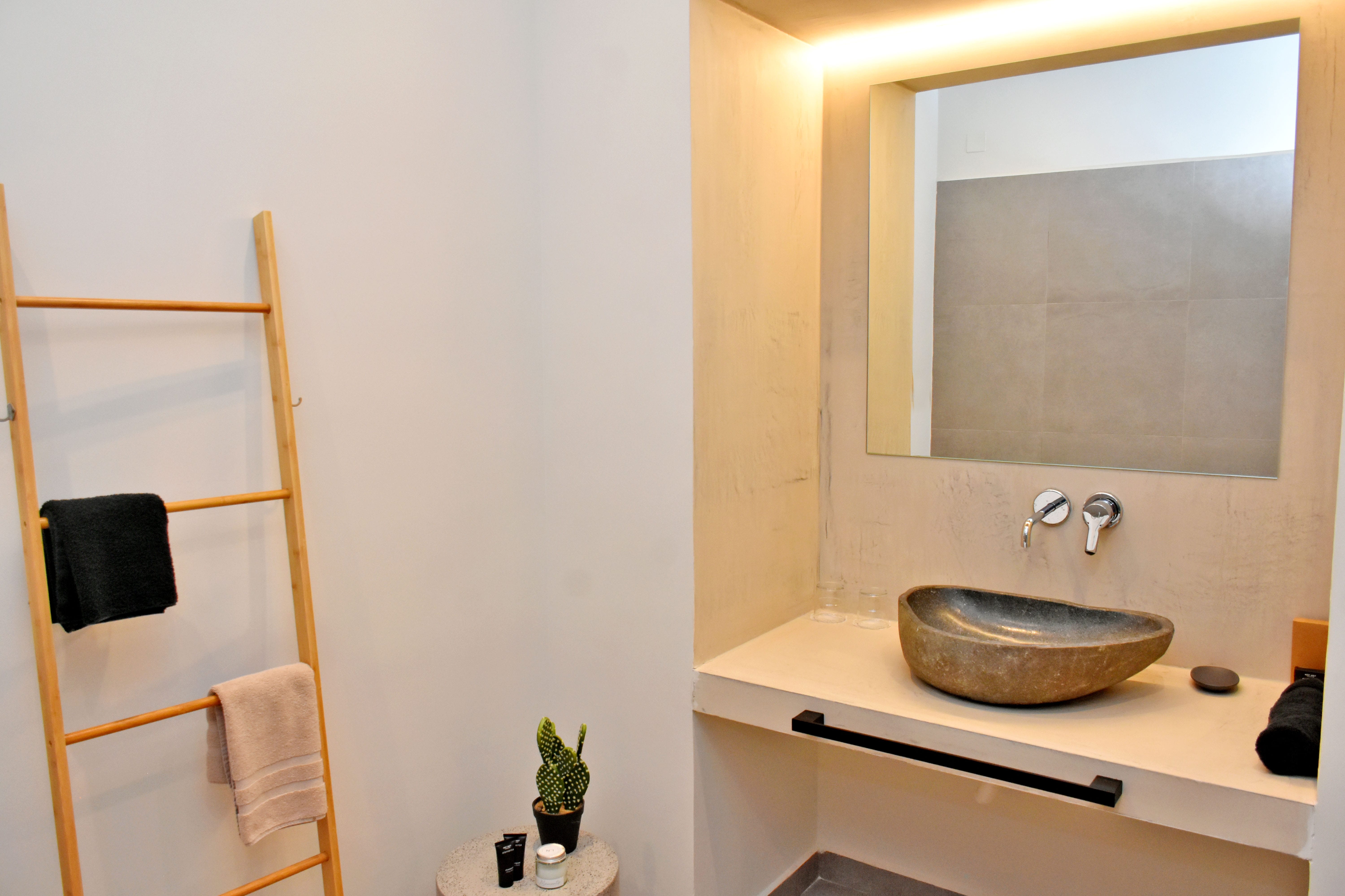 a bathroom with a mirror and sink