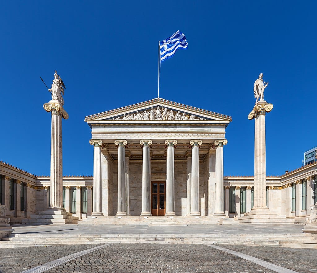 a building with columns and a flag