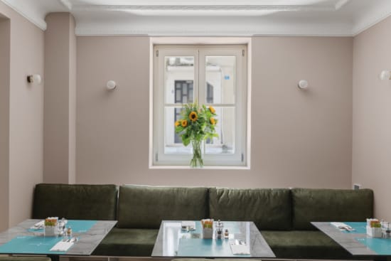 a vase of flowers on a couch