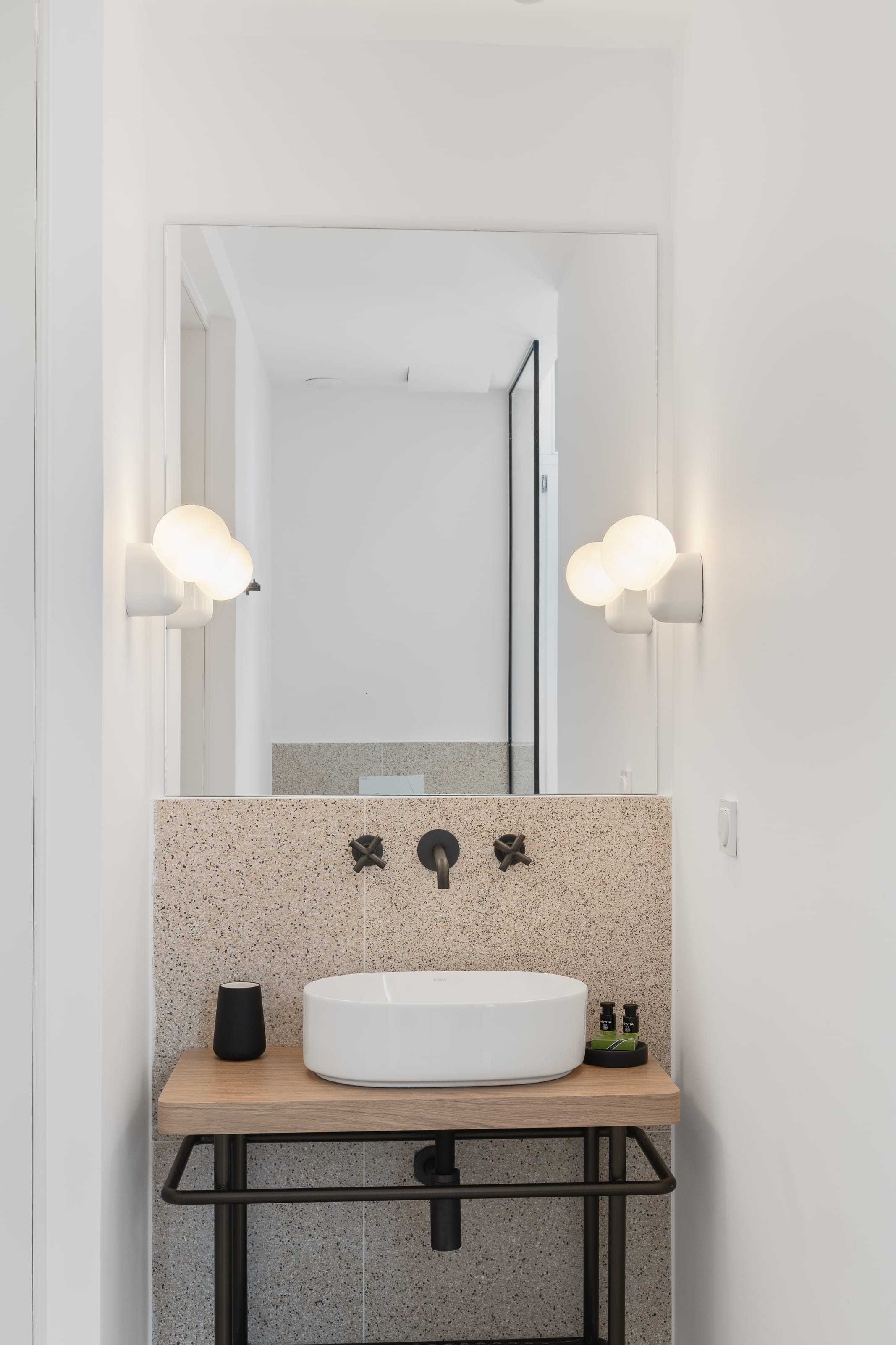 a bathroom with a mirror and sink