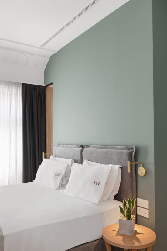 a bed with white sheets