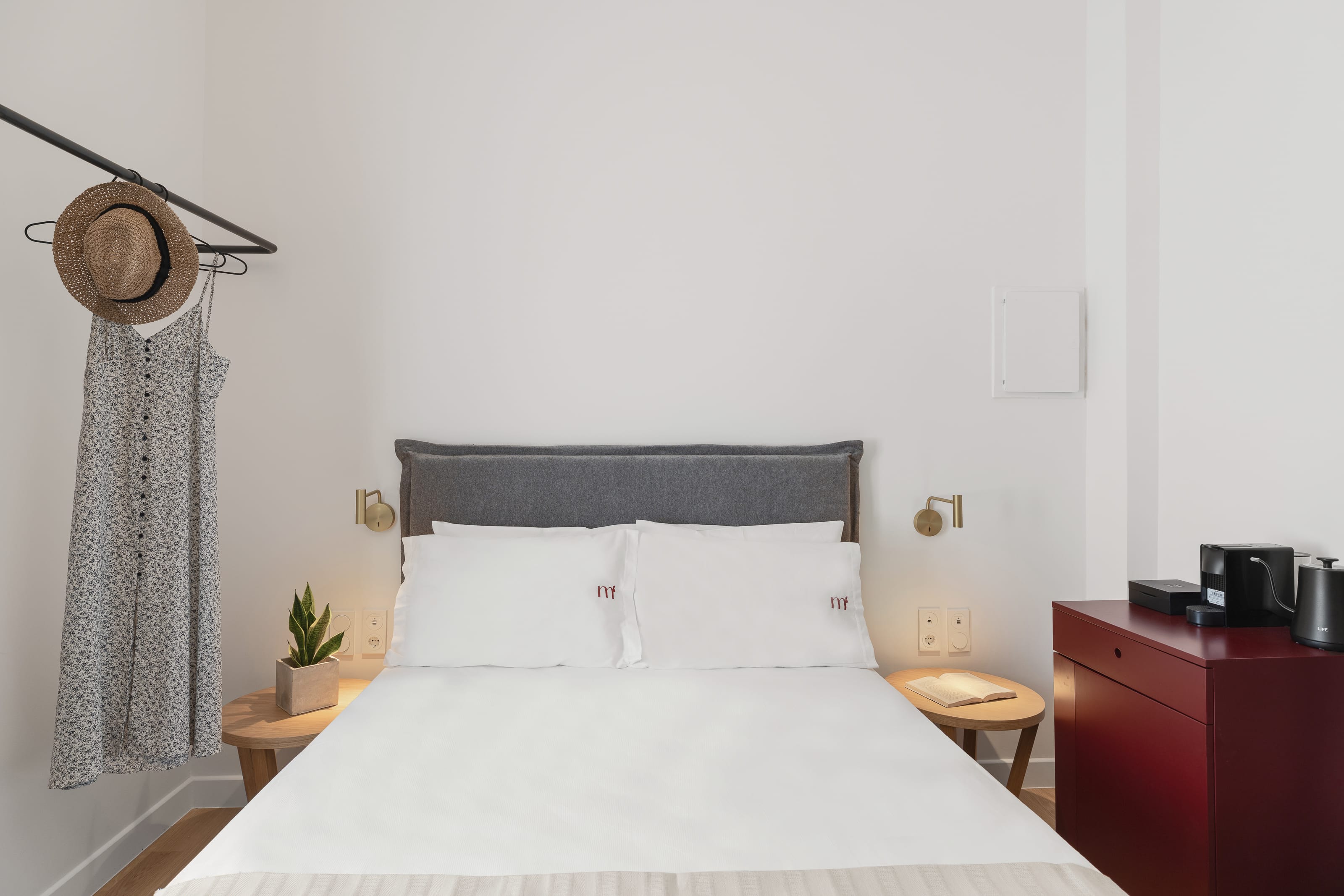 a bed with a white bed spread