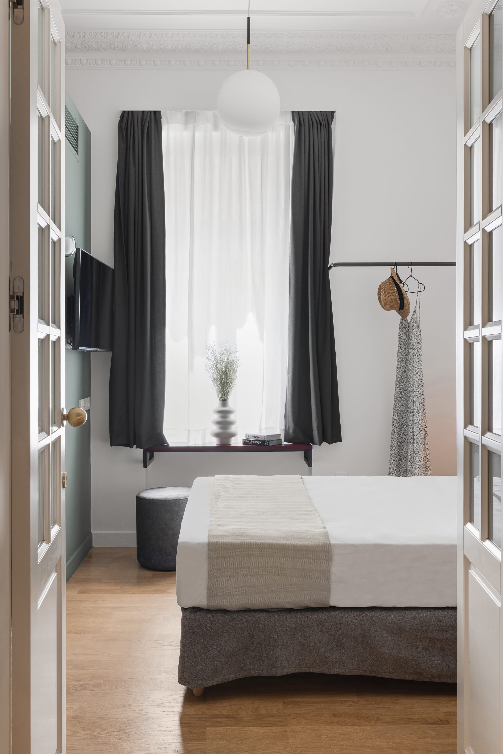 a room with a bed and a window