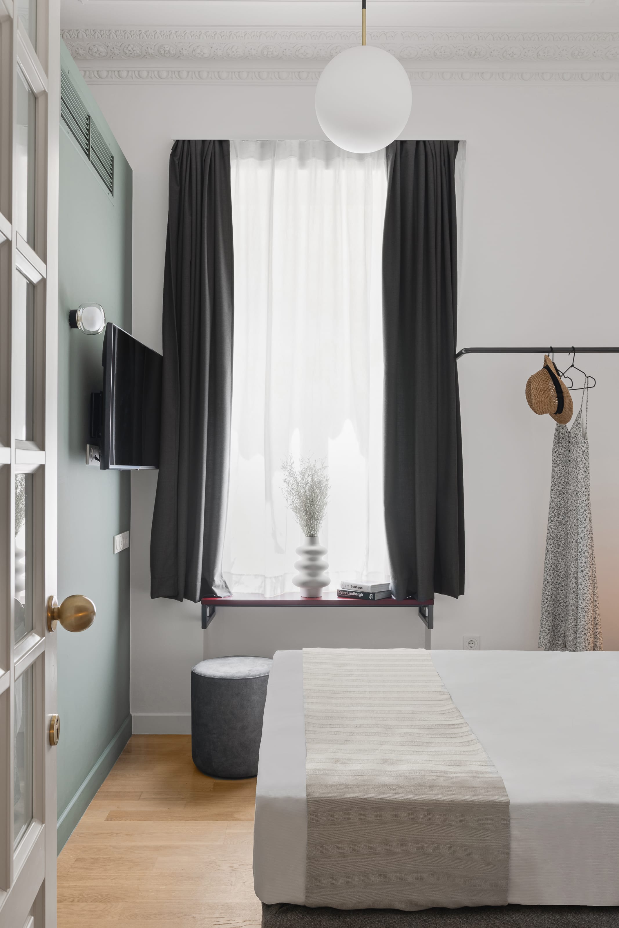 a room with a bed and a window