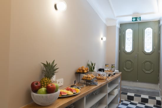 a kitchen with a counter and fruit