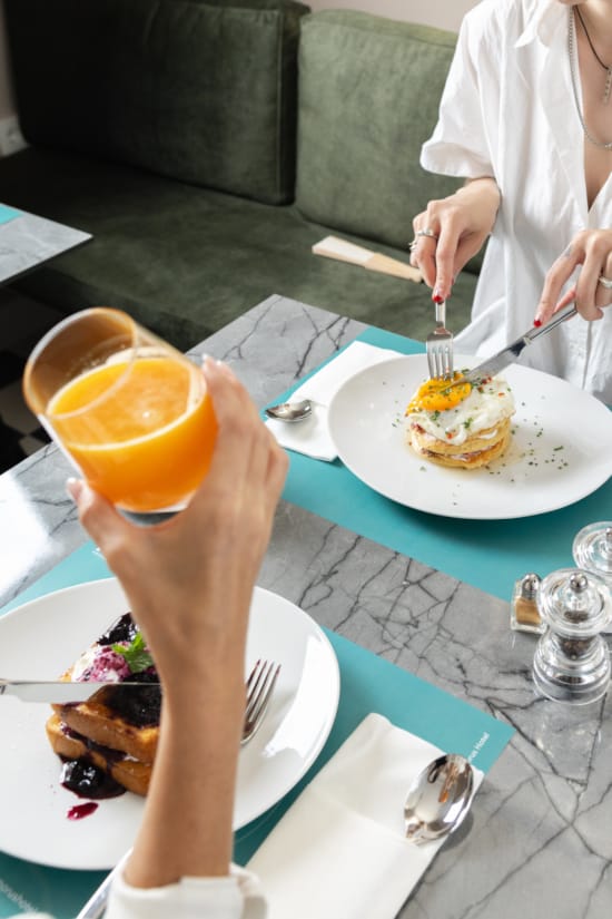 a person eating a breakfast