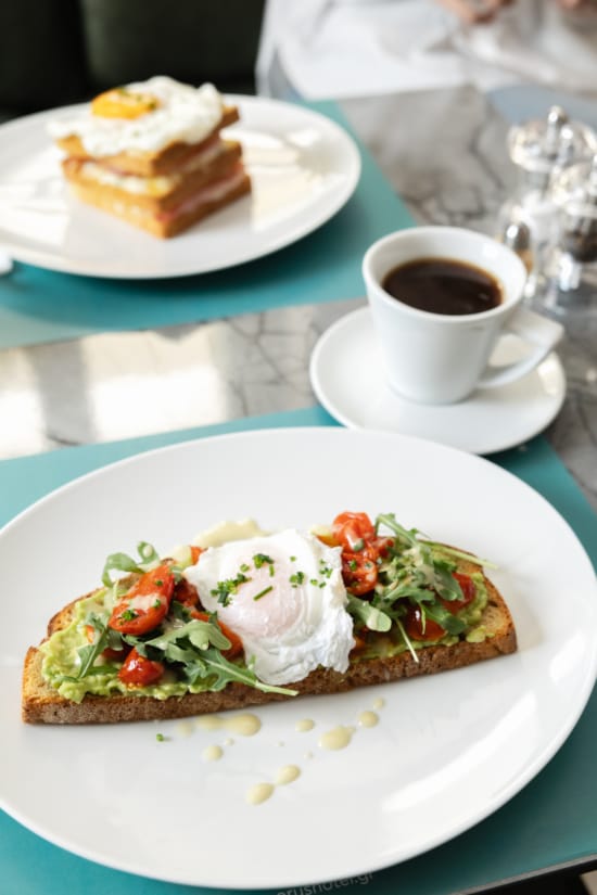 a plate of food and a cup of coffee
