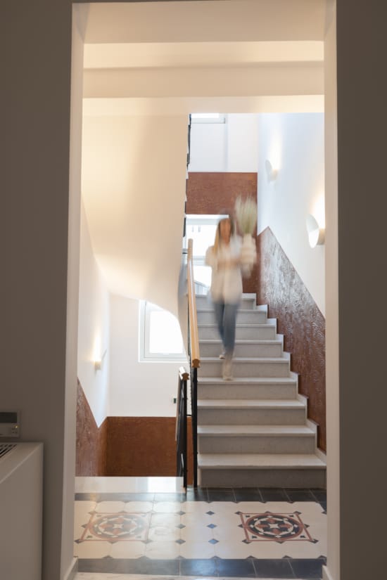 a person walking up a staircase