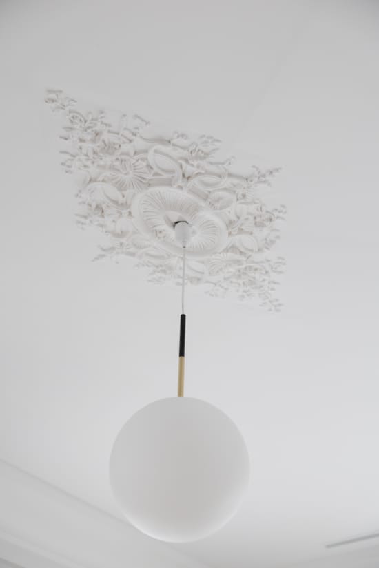 a white lamp with a white shade