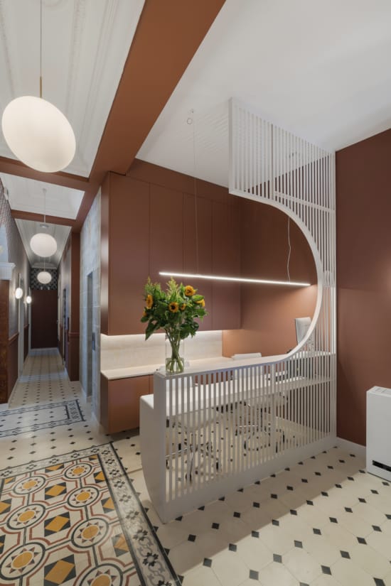 a staircase with a flower on the railing