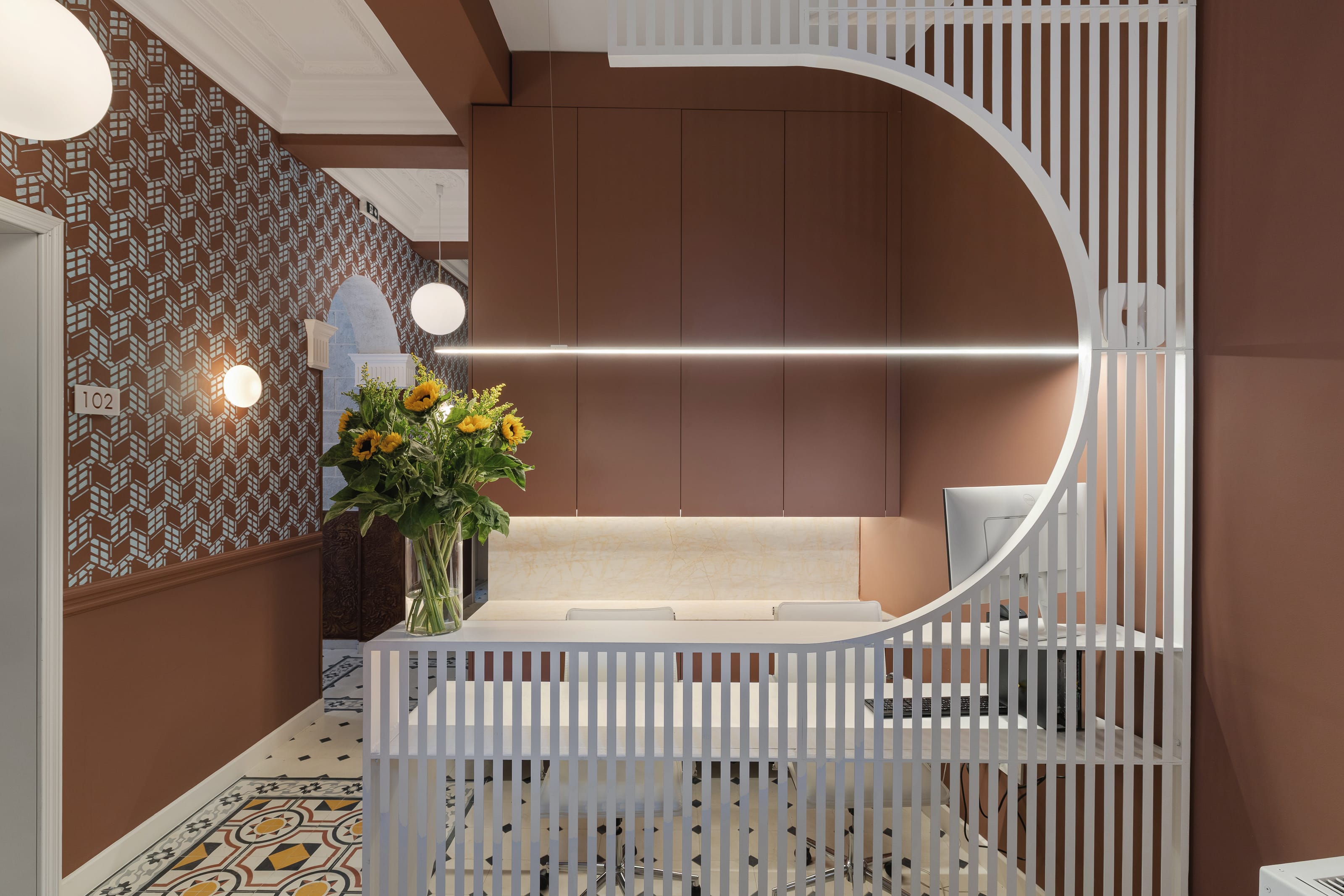 a bathroom with a tub and flowers