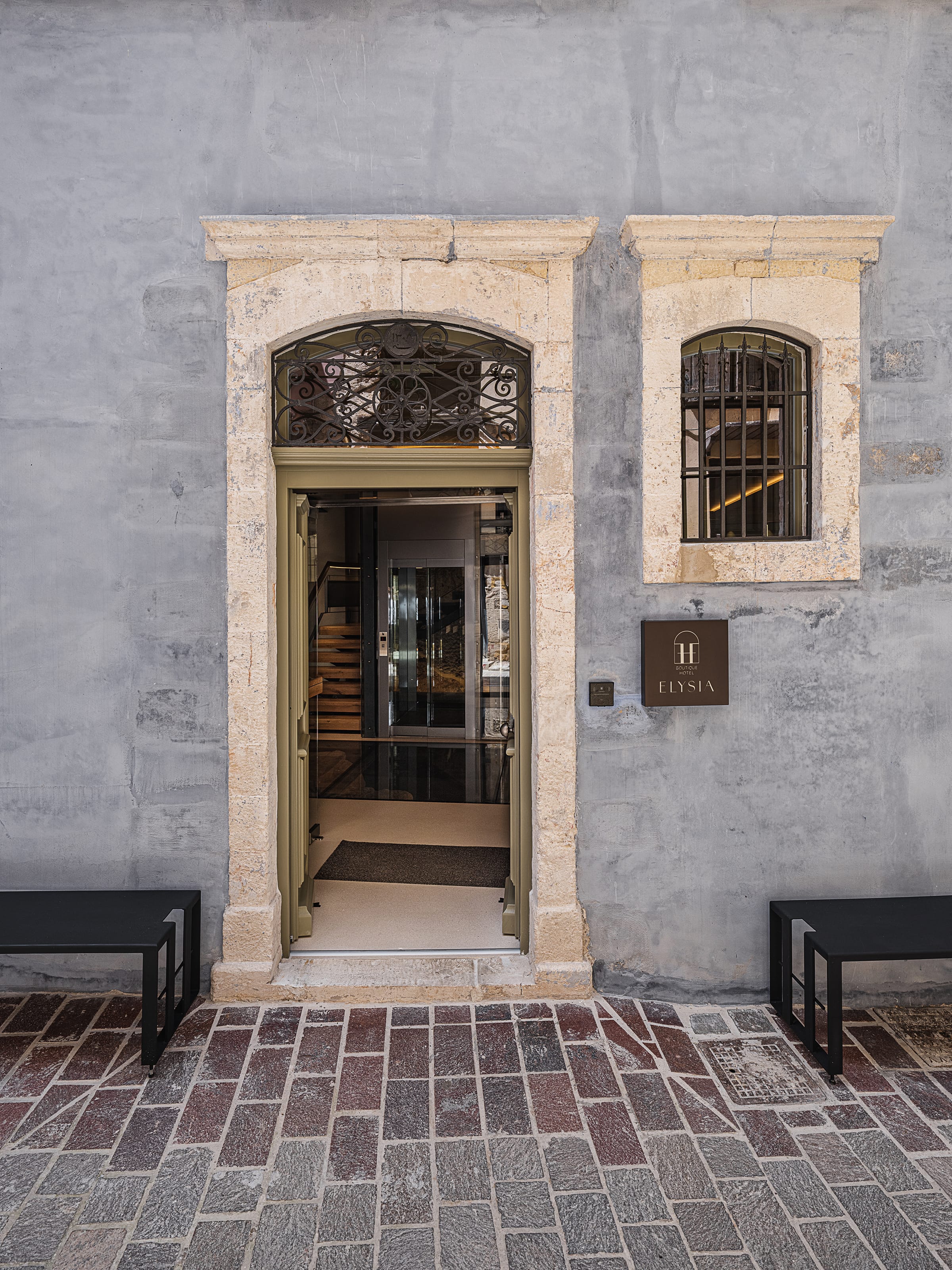 a stone building with a door and windows