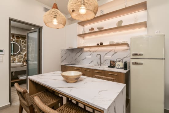 a kitchen with a table and chairs