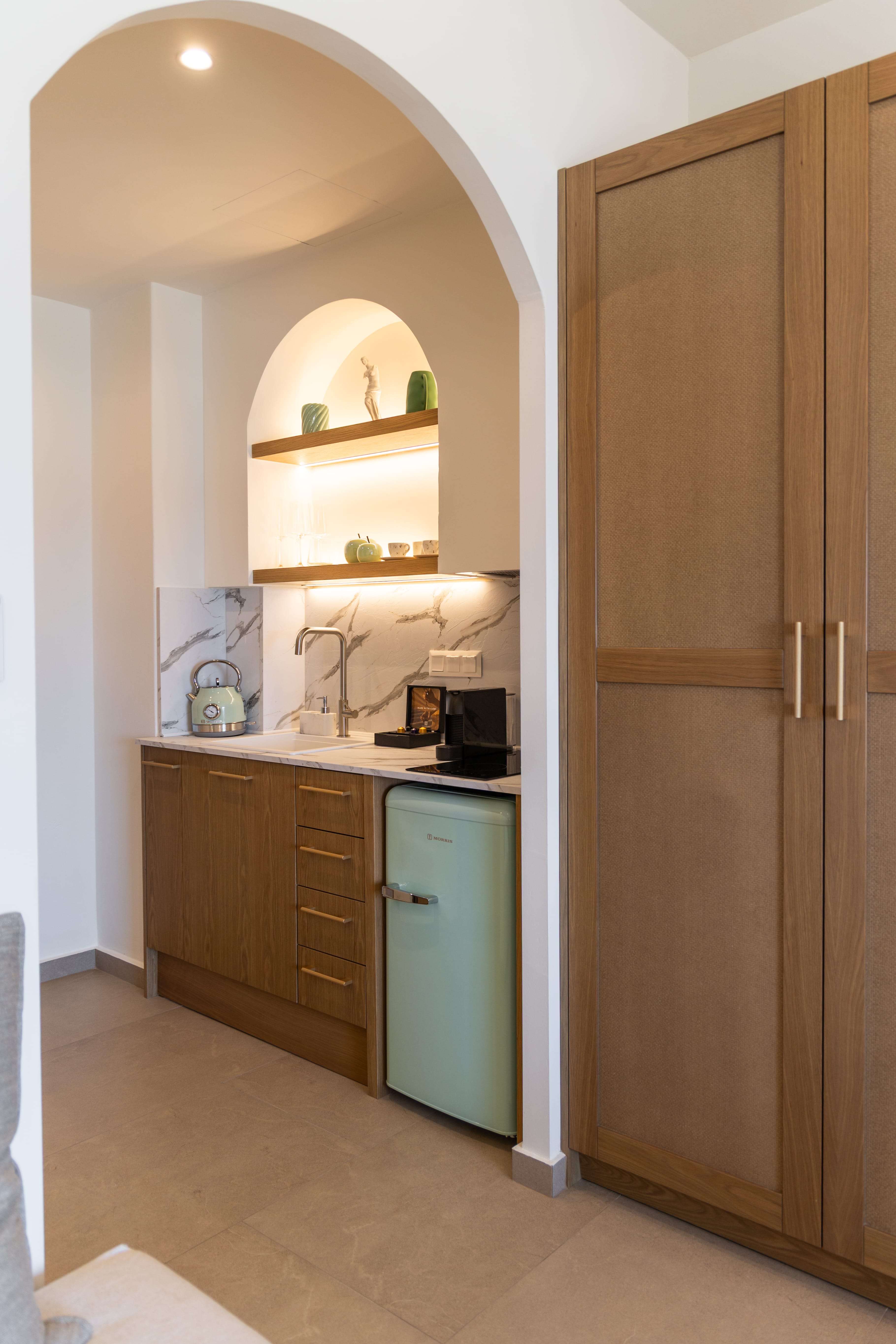a kitchen with a mirror and cabinets