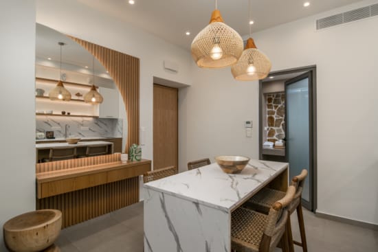 a kitchen with a table and chairs