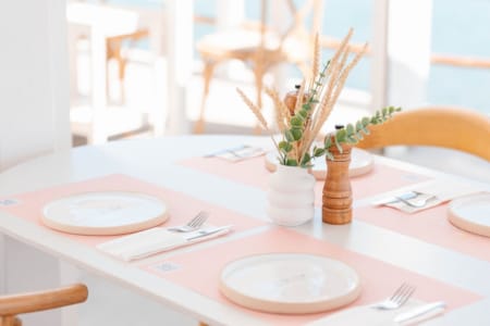 a table with plates and a plant
