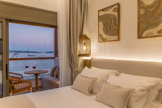 a bedroom with a large window