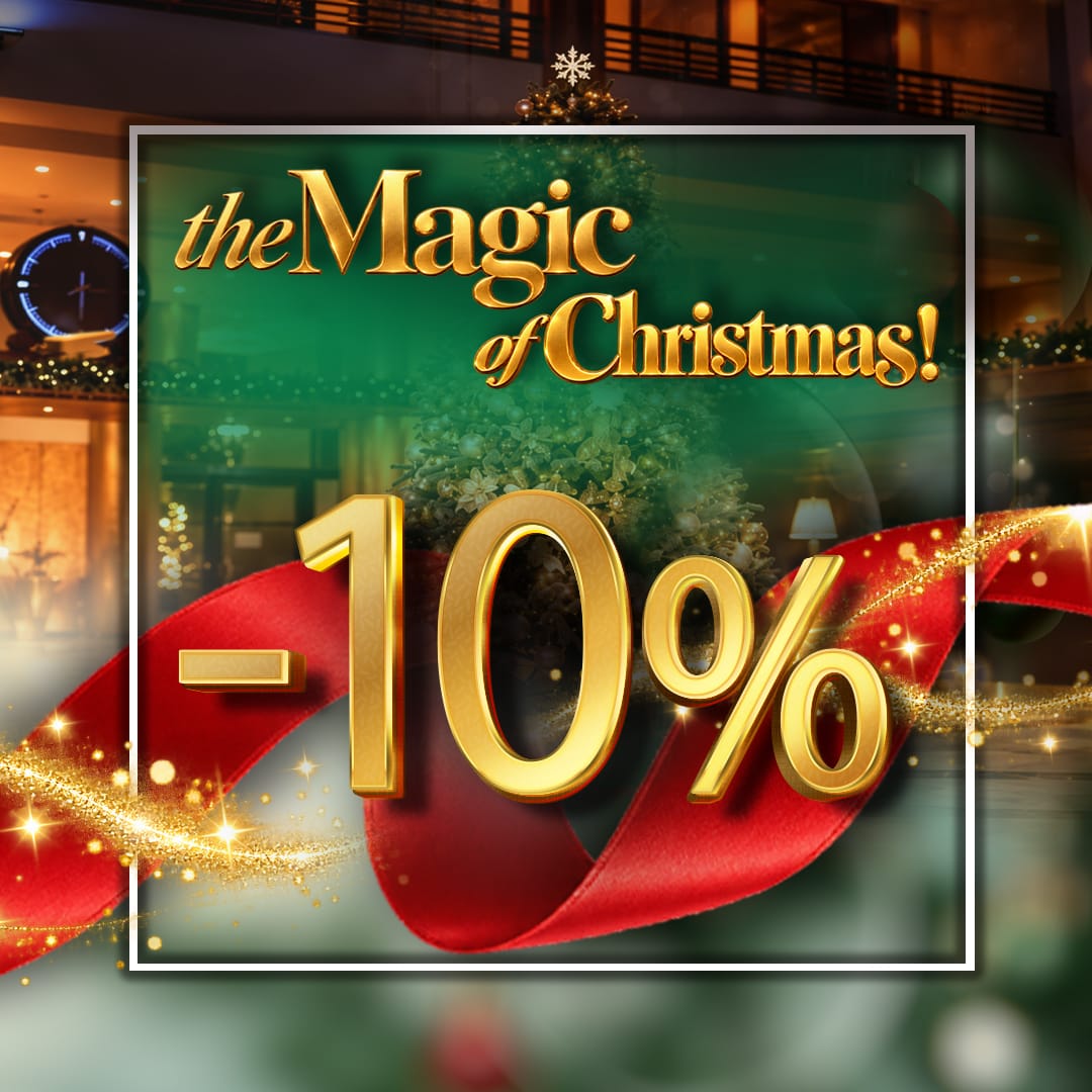 a christmas sale sign with a red ribbon