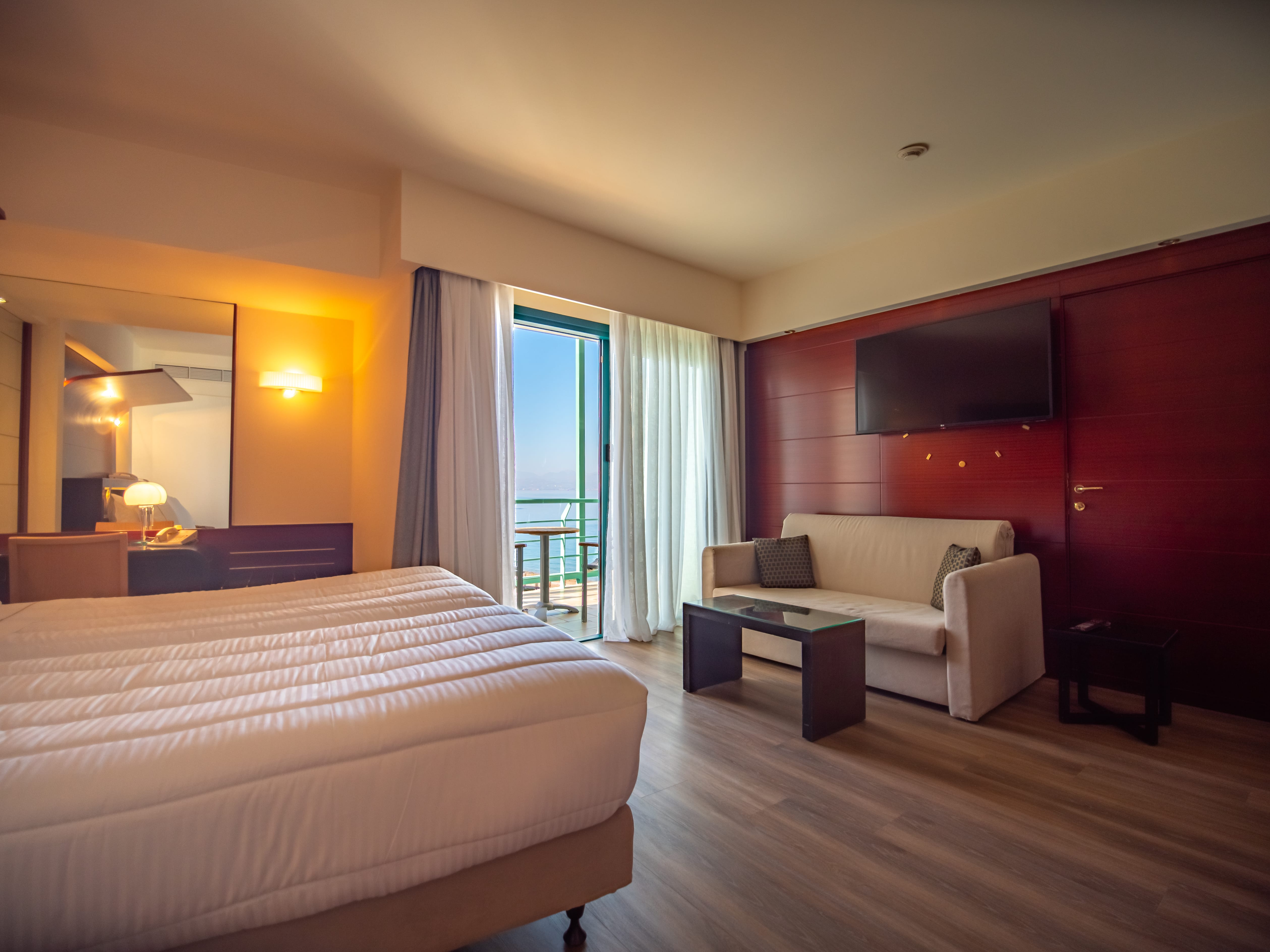 a hotel room with a bed and a couch