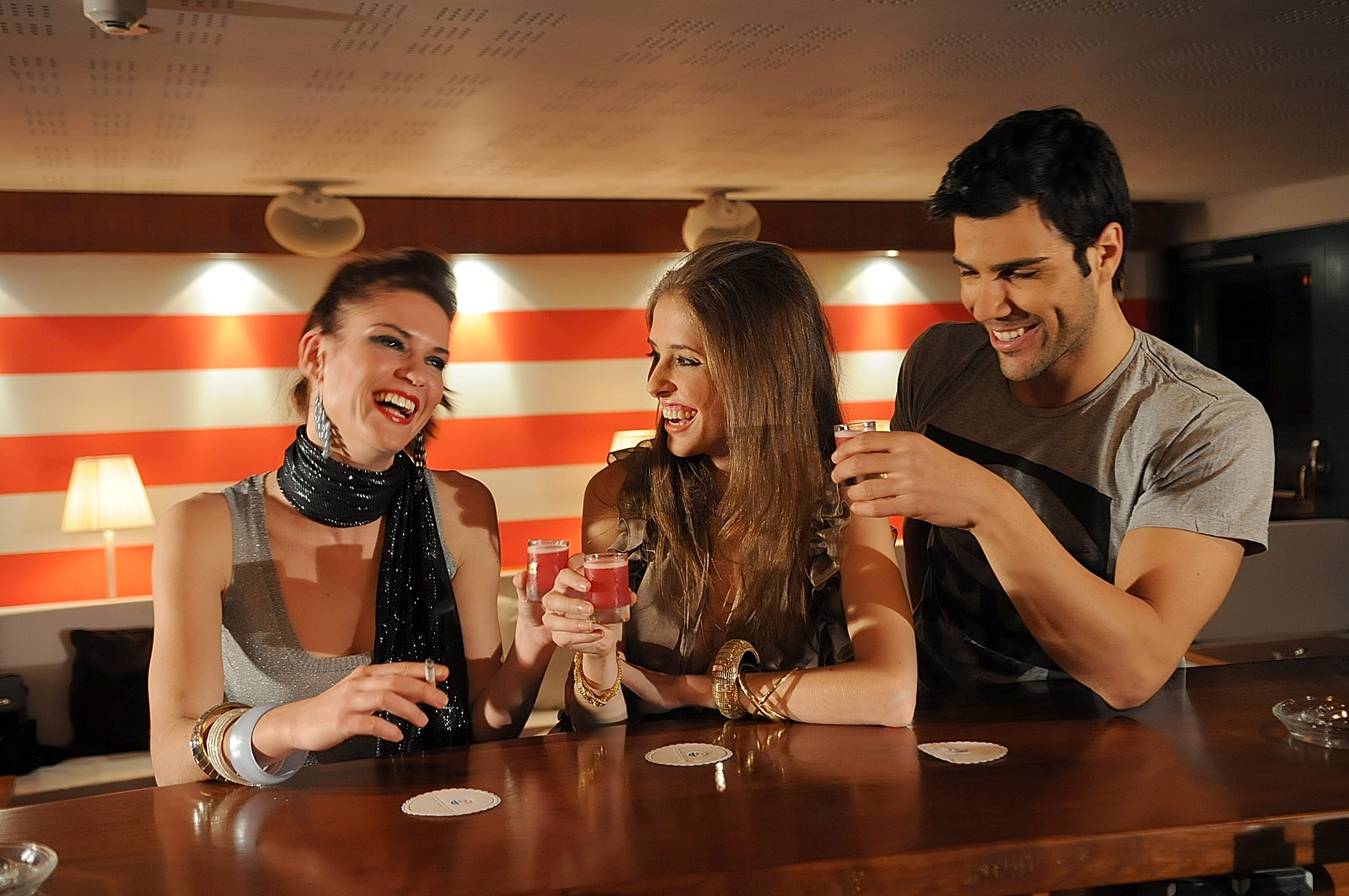a group of people sitting at a table with drinks