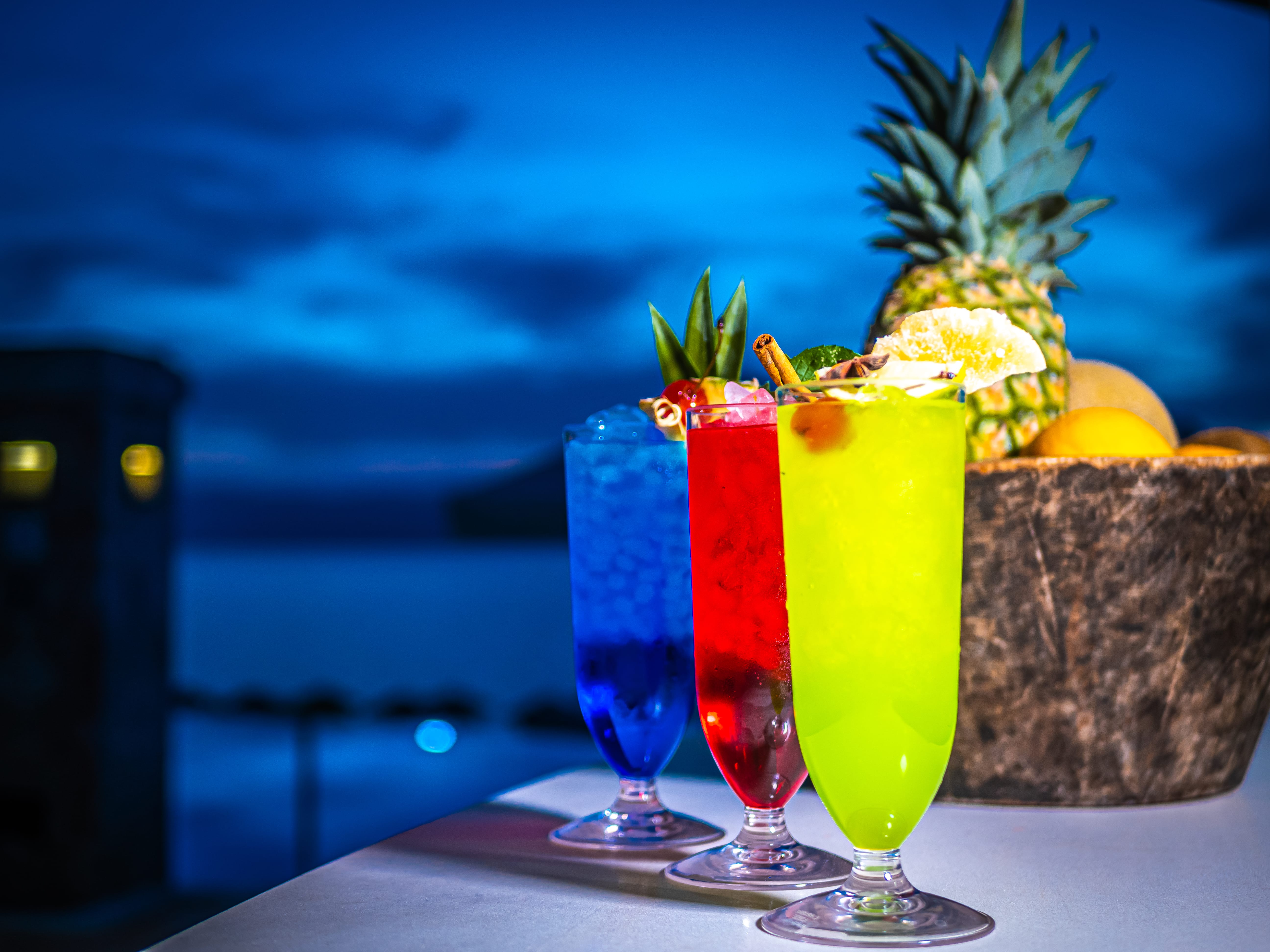 a couple of colorful drinks