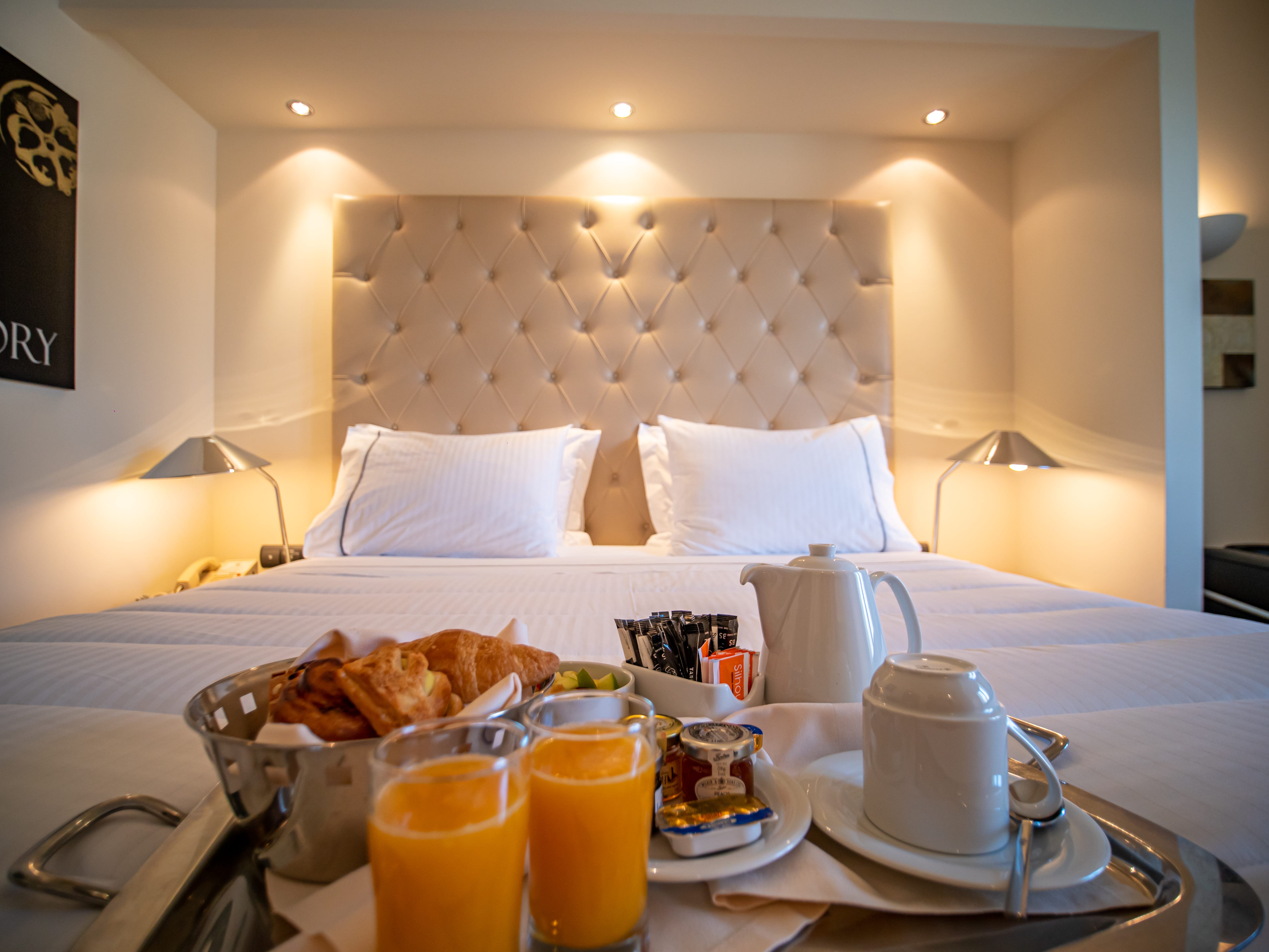 a hotel room with a bed and breakfast