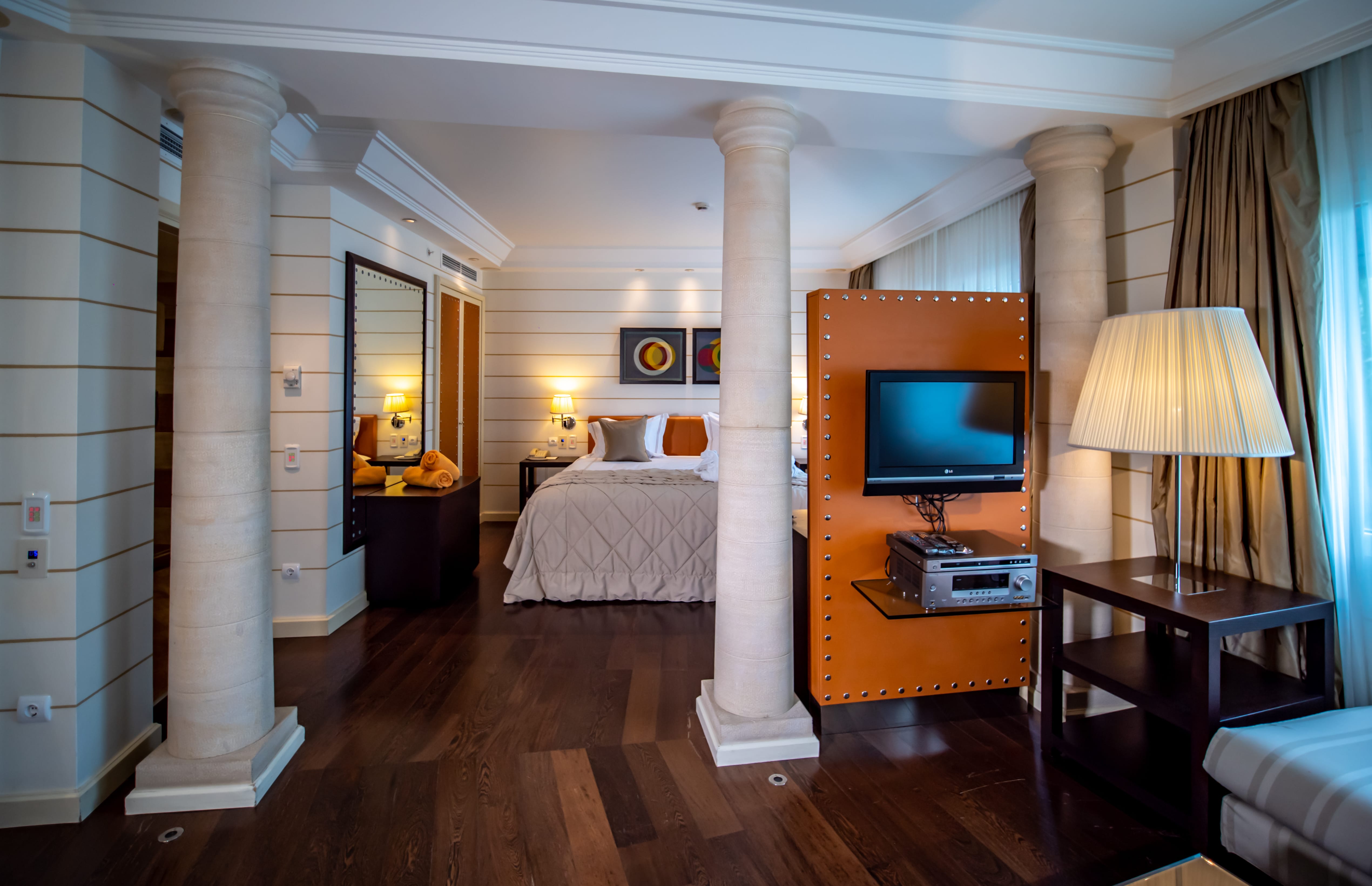 a bedroom with a tv and a bed