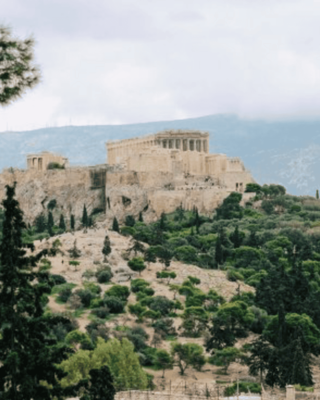 a stone building on a hill