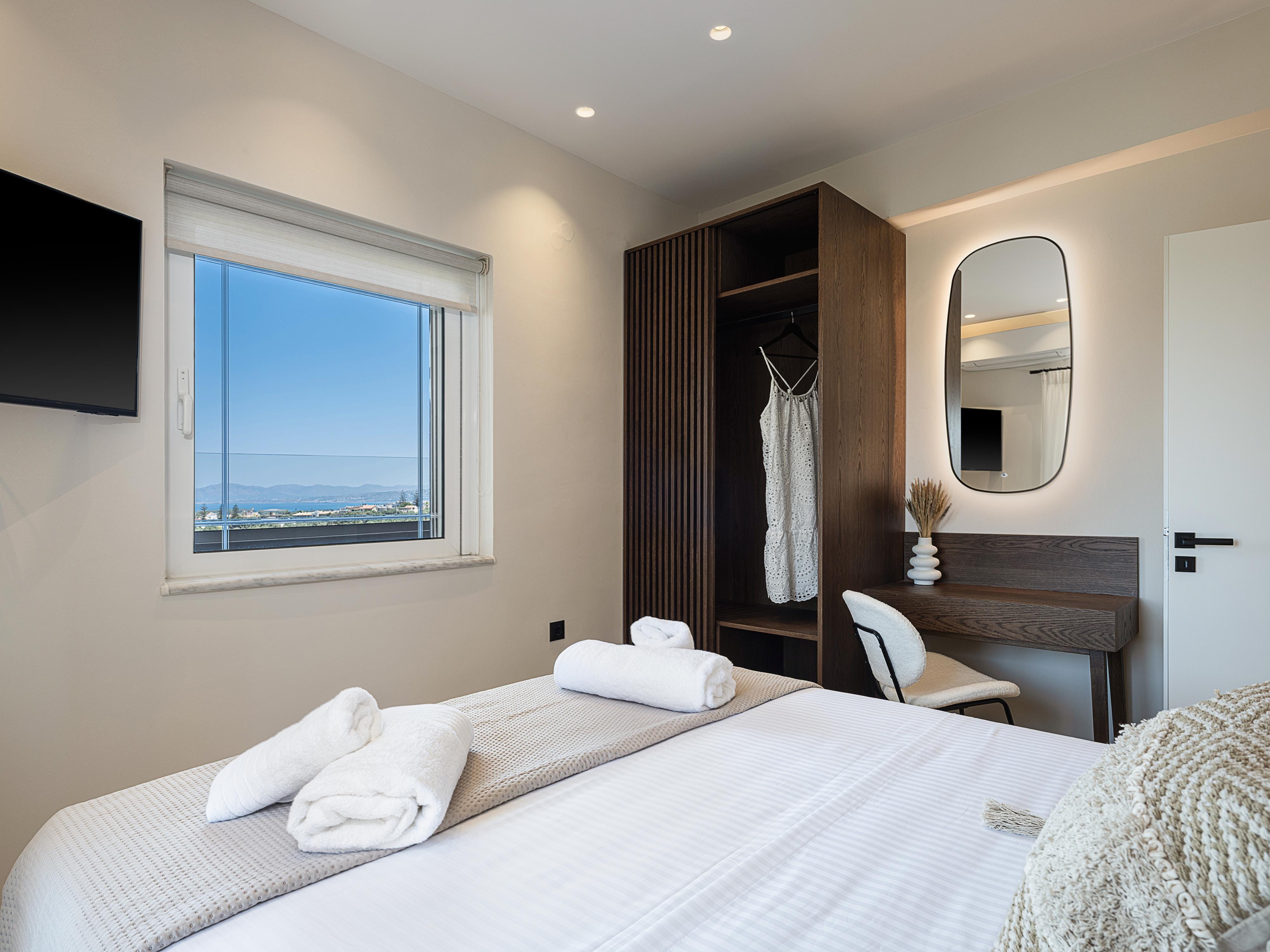 a hotel room with a bed and a desk