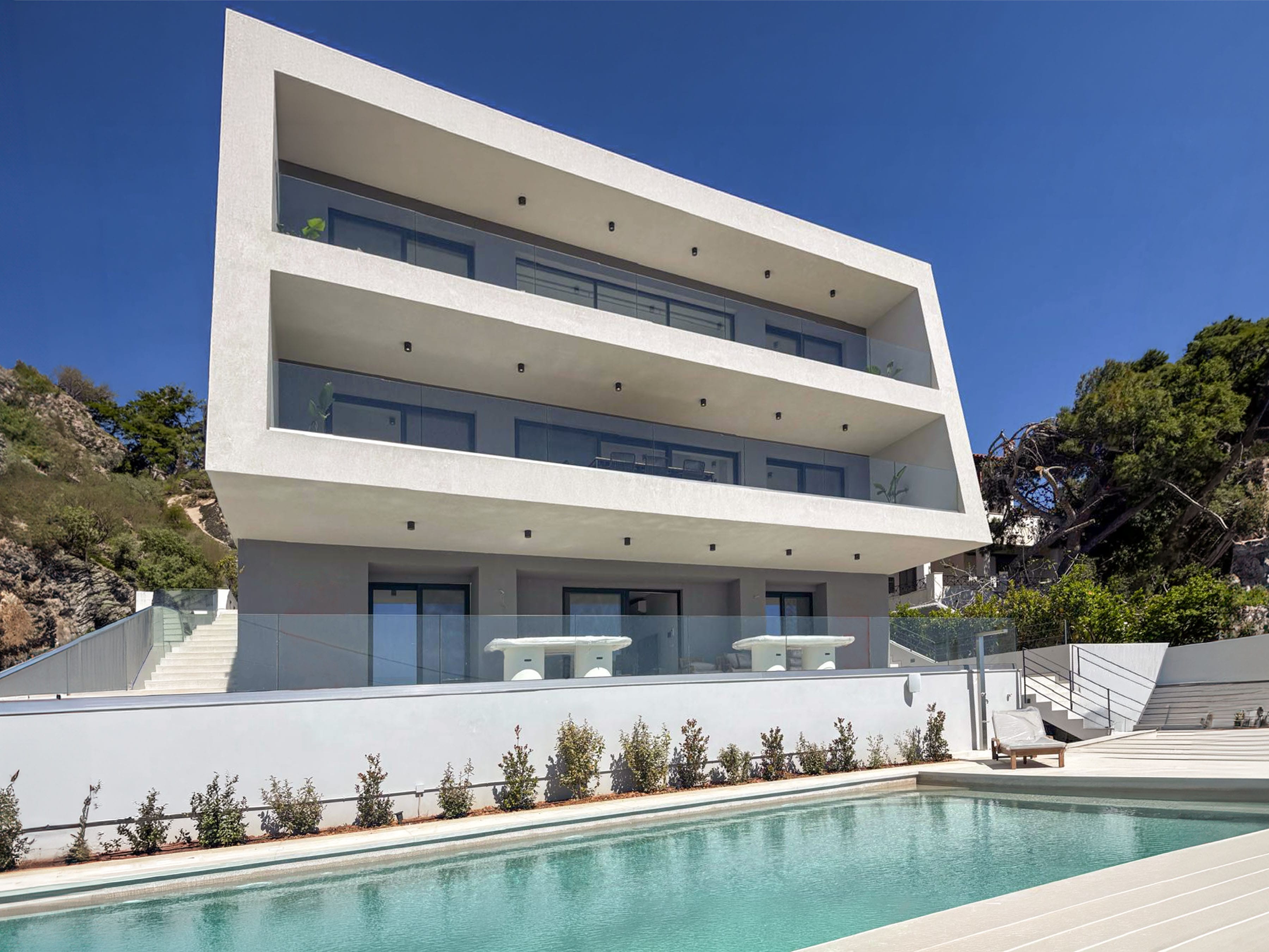 a building with a pool in front