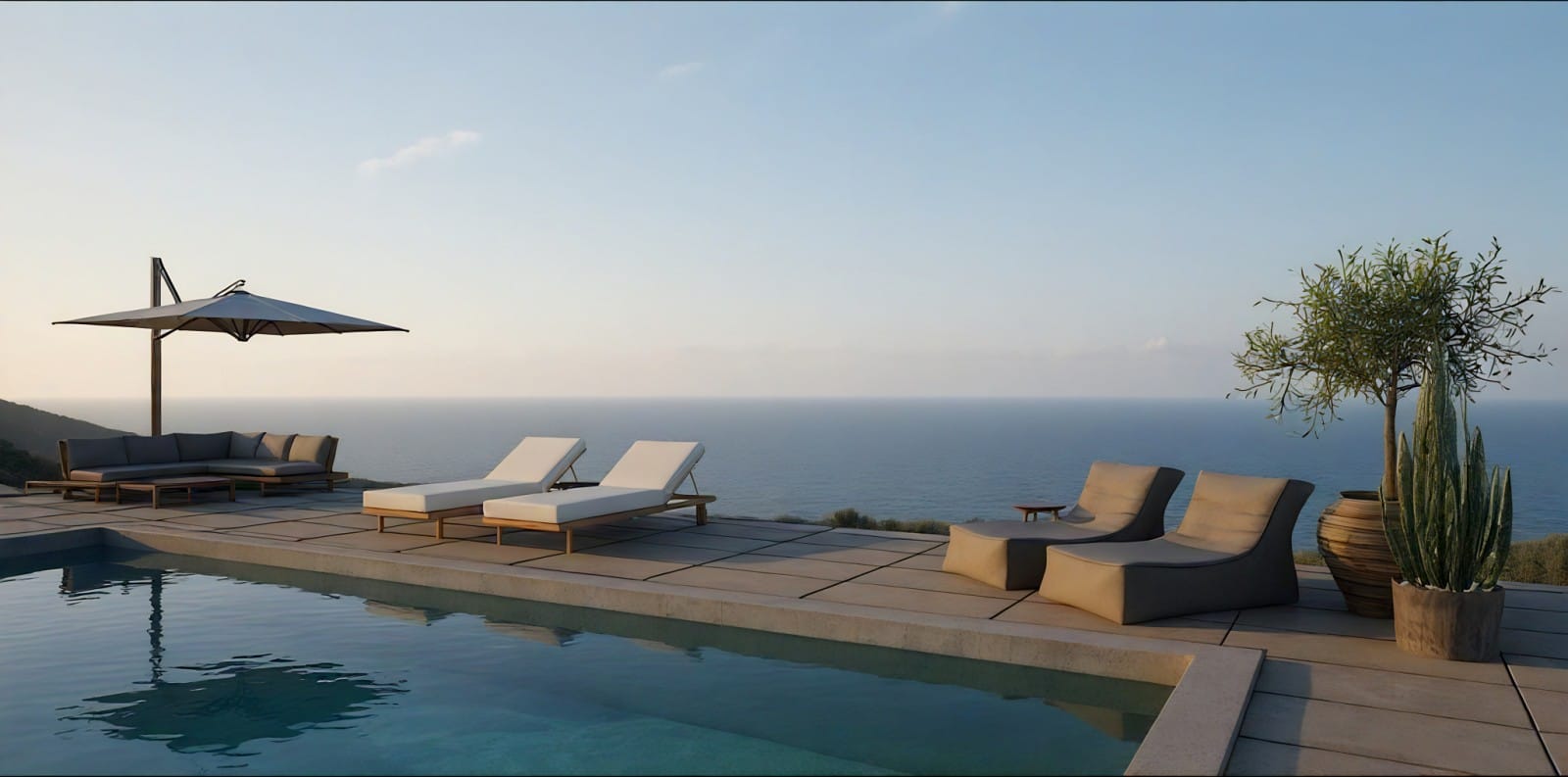 a pool with lounge chairs and umbrellas by a body of water