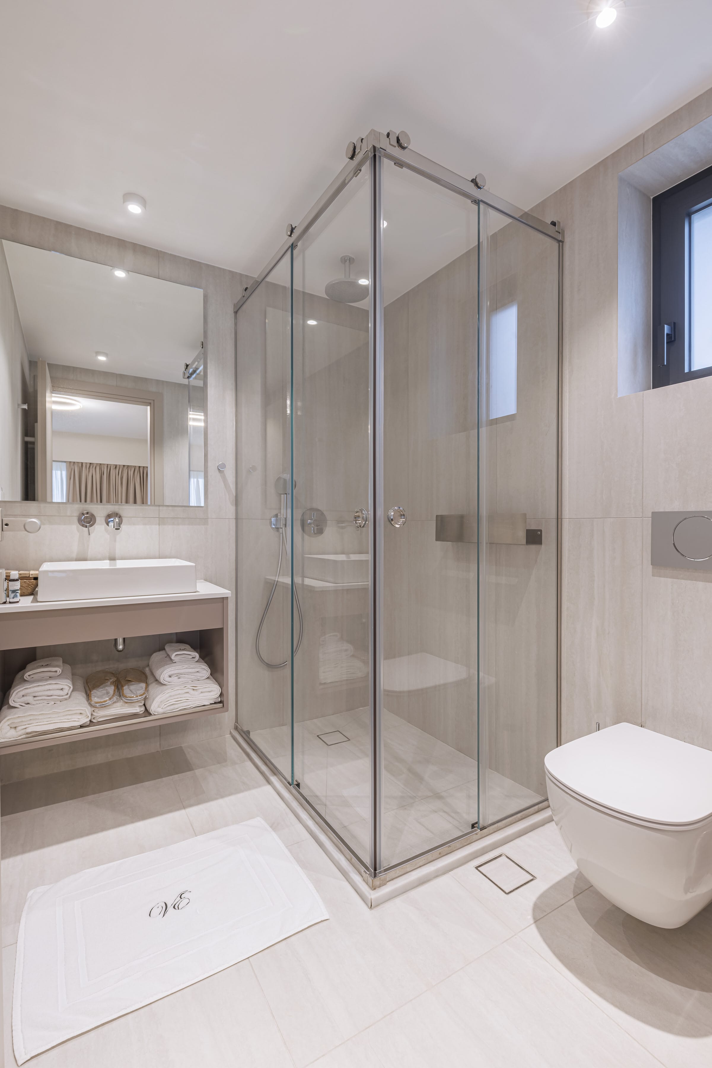 a bathroom with a glass shower