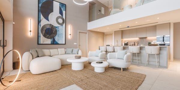 a room with a couch and chairs