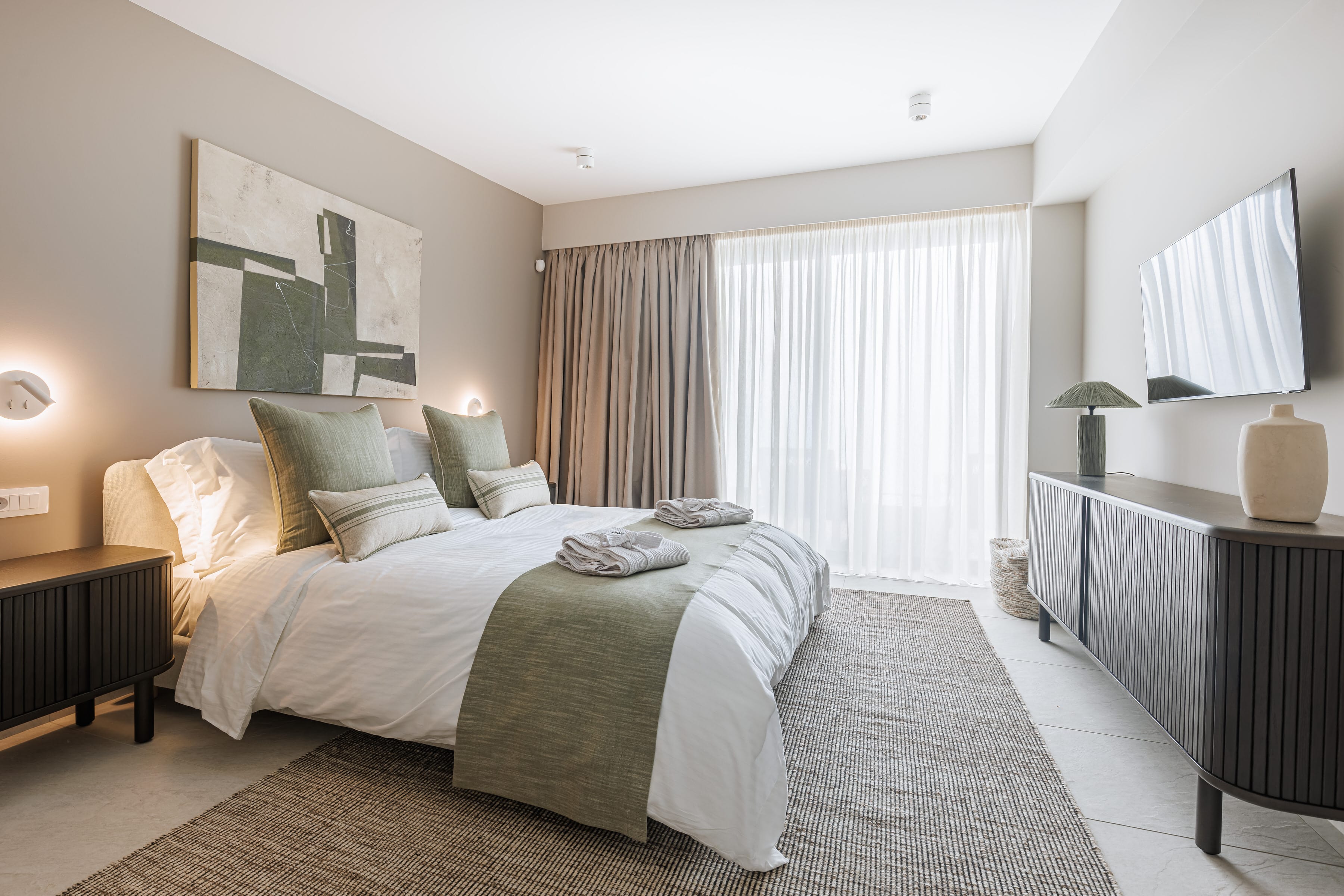 a bedroom with a bed and a desk