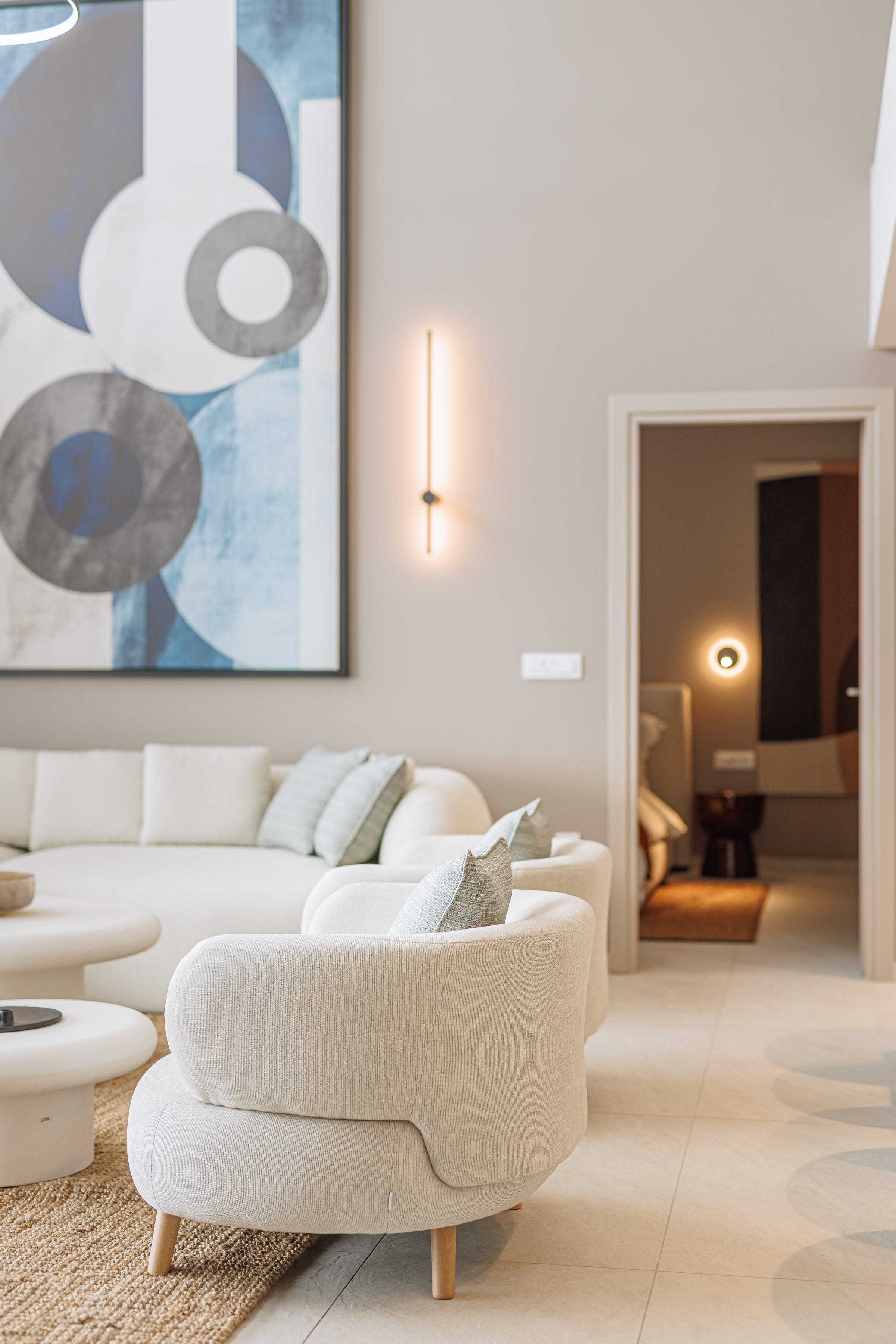 a living room with white couches