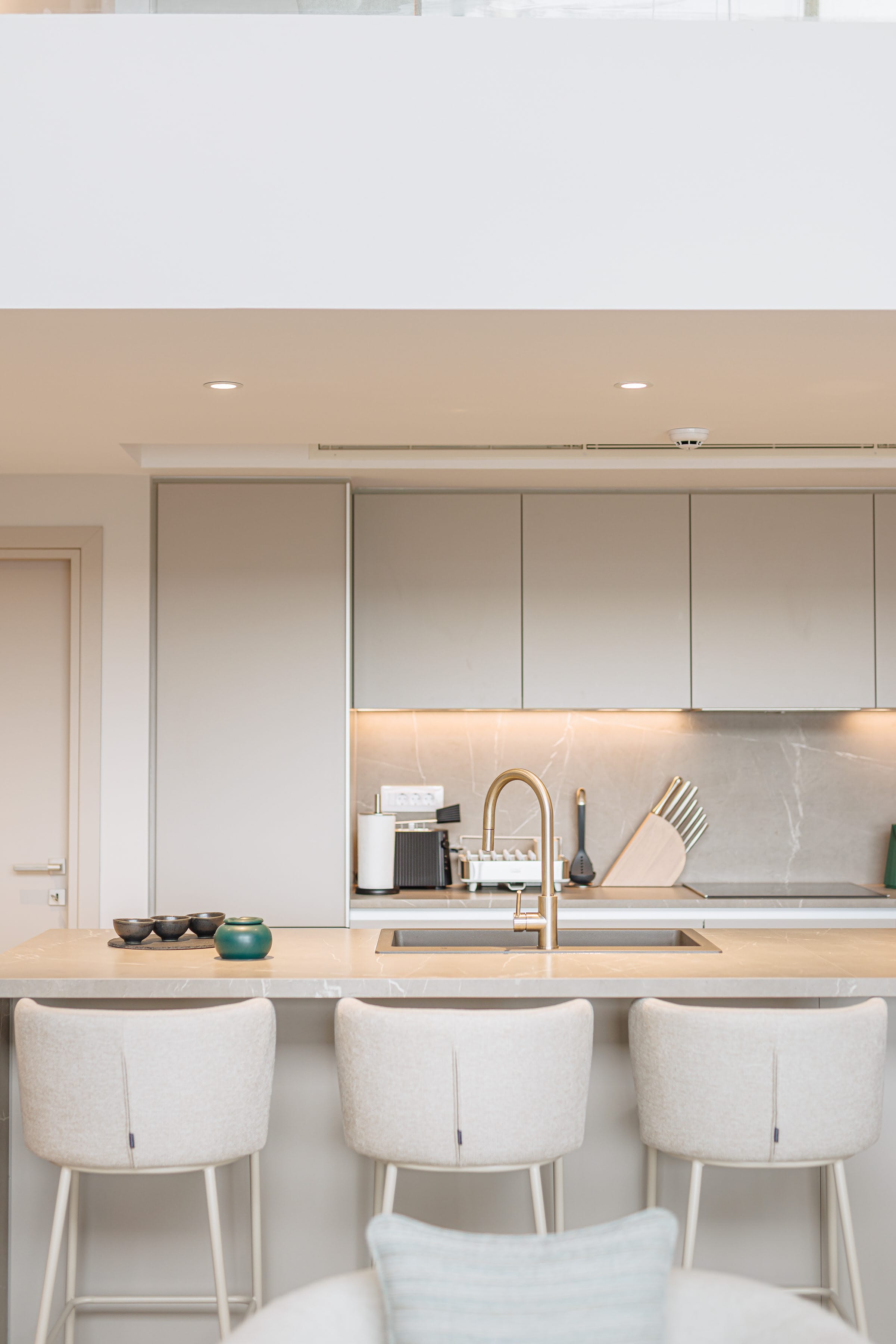 a kitchen with white cabinets