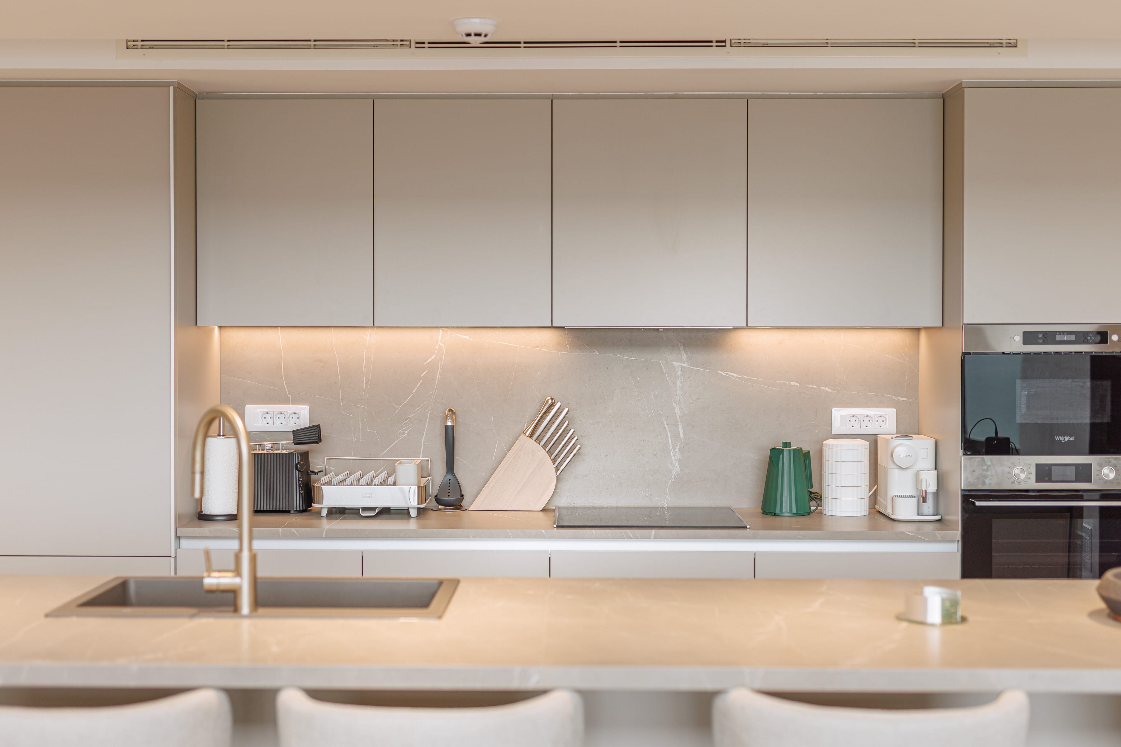 a kitchen with white cabinets