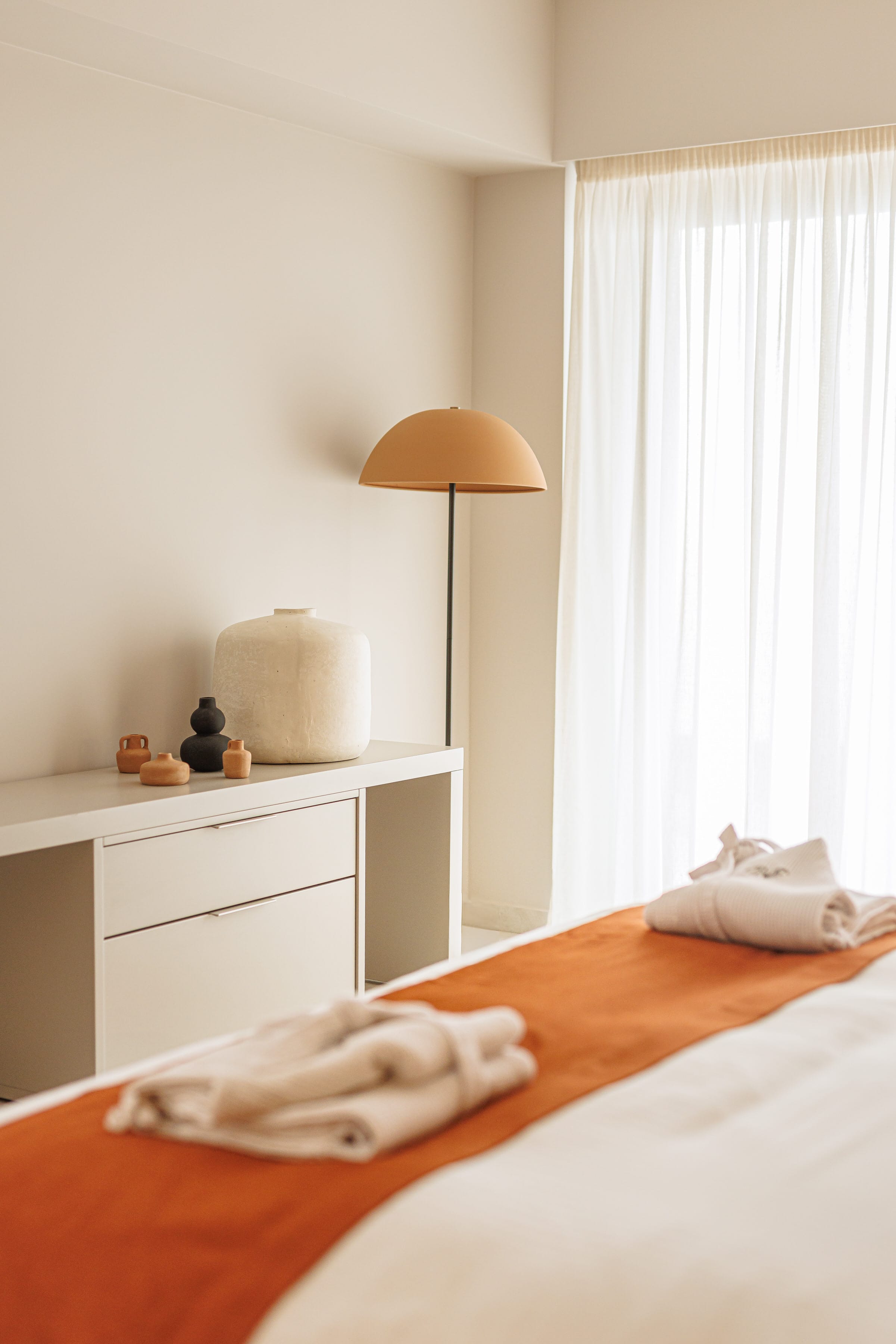 a bed with a lamp on it