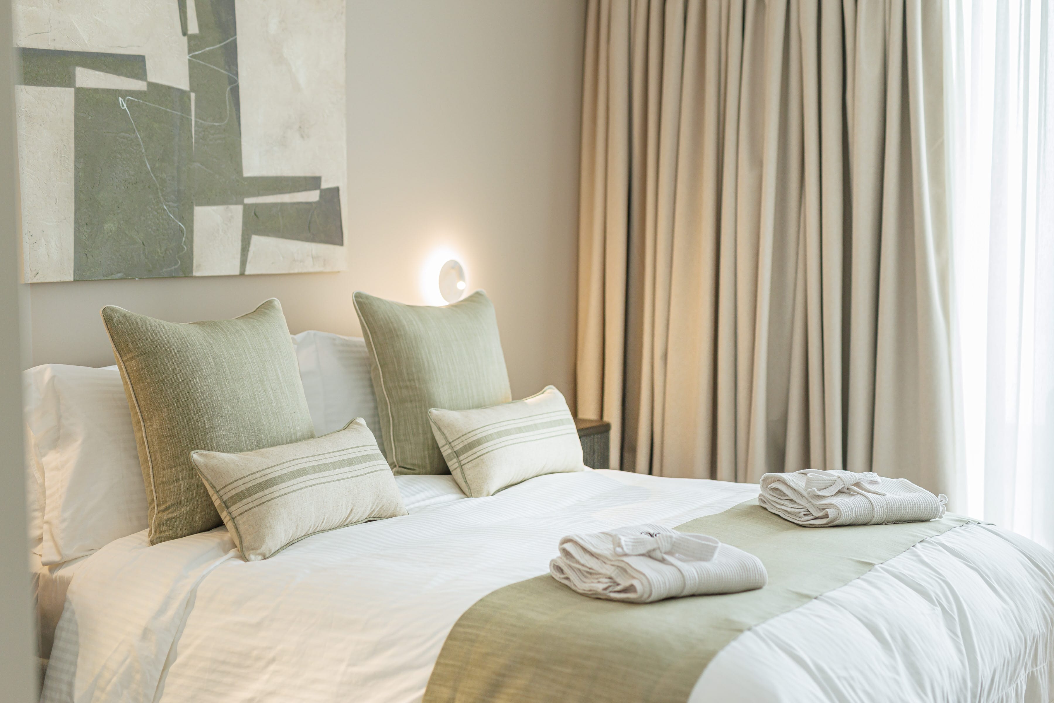 a bed with white pillows