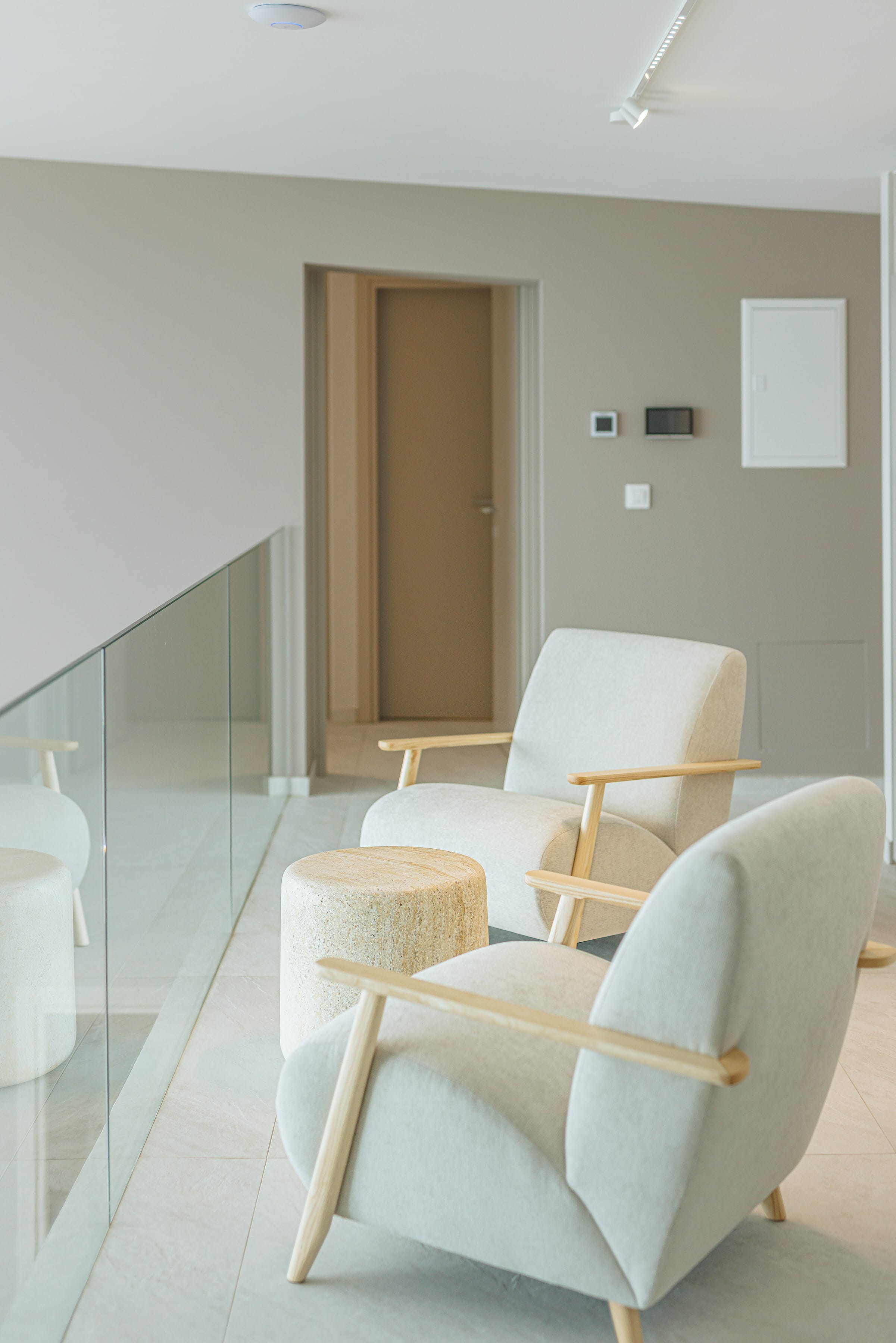 a room with white chairs