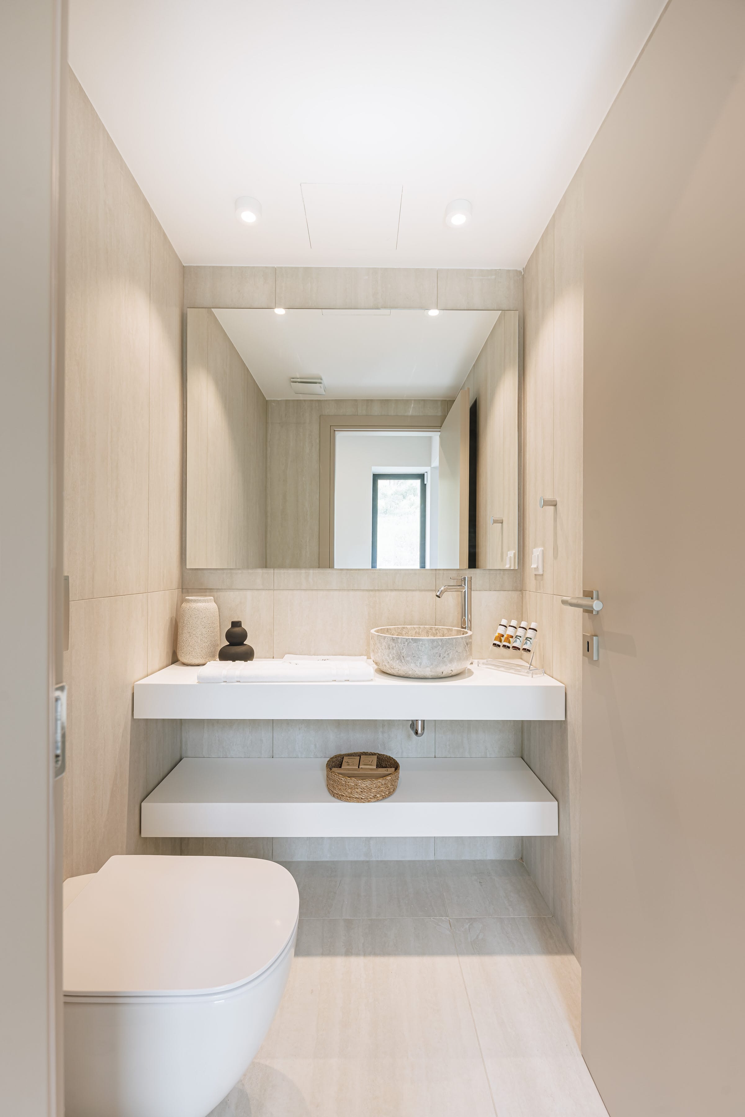 a bathroom with a mirror and sink