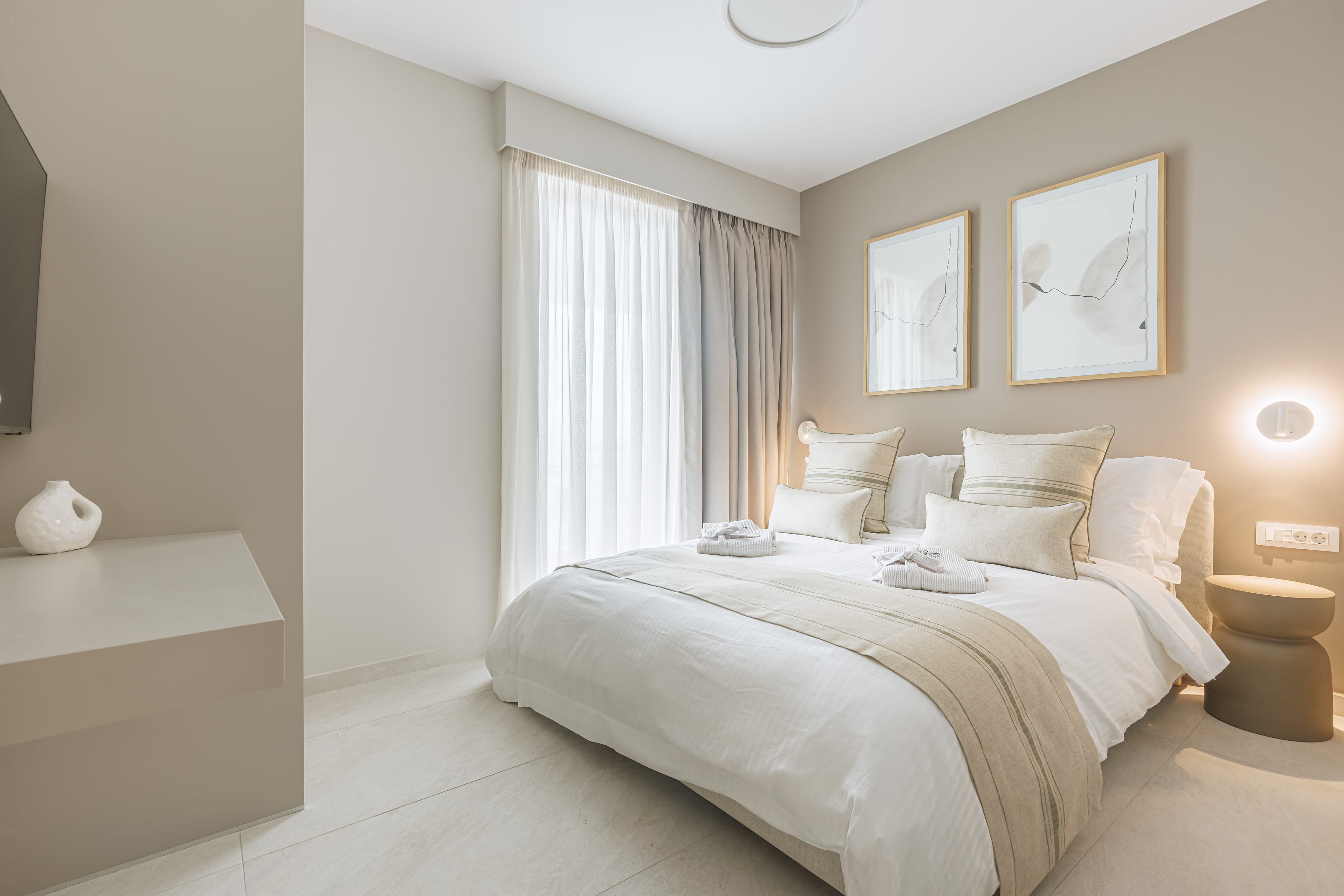 a bedroom with a bed and a chair