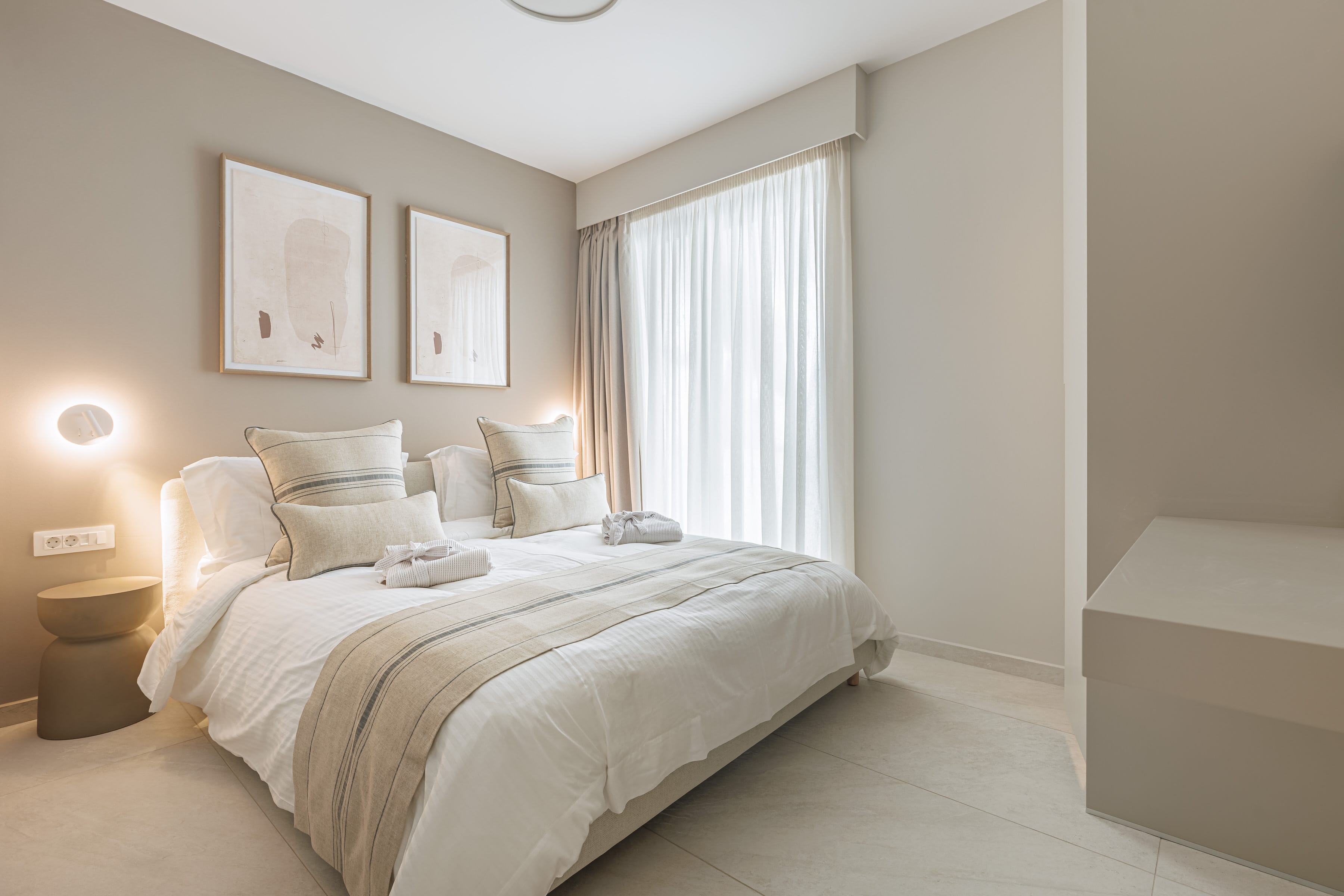 a bedroom with a bed and a chair