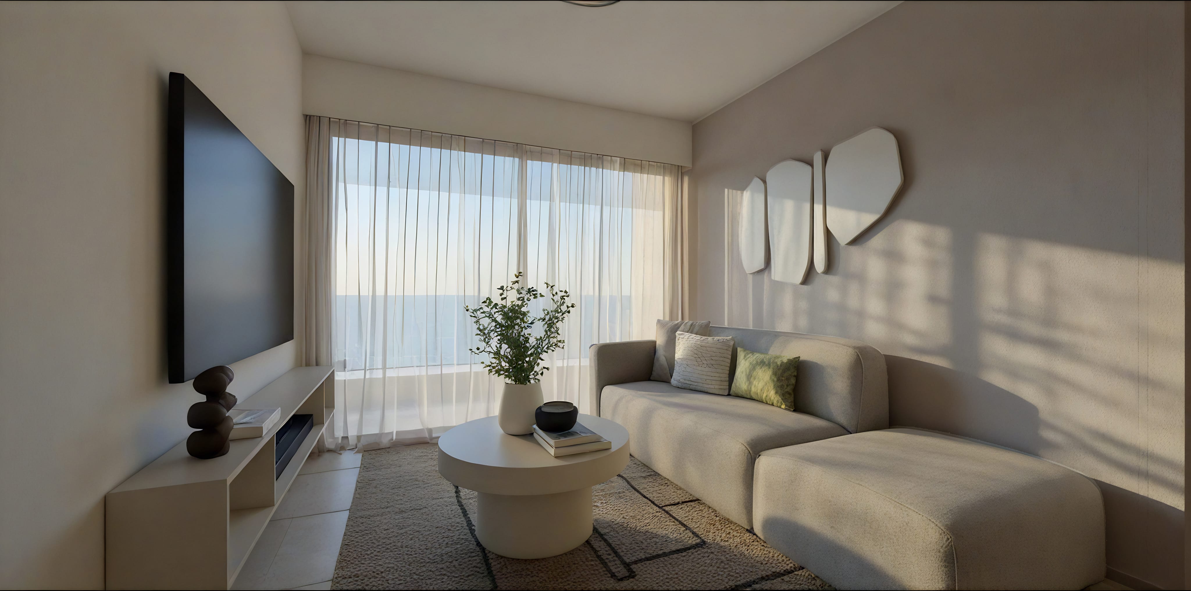 a living room with a tv and couches