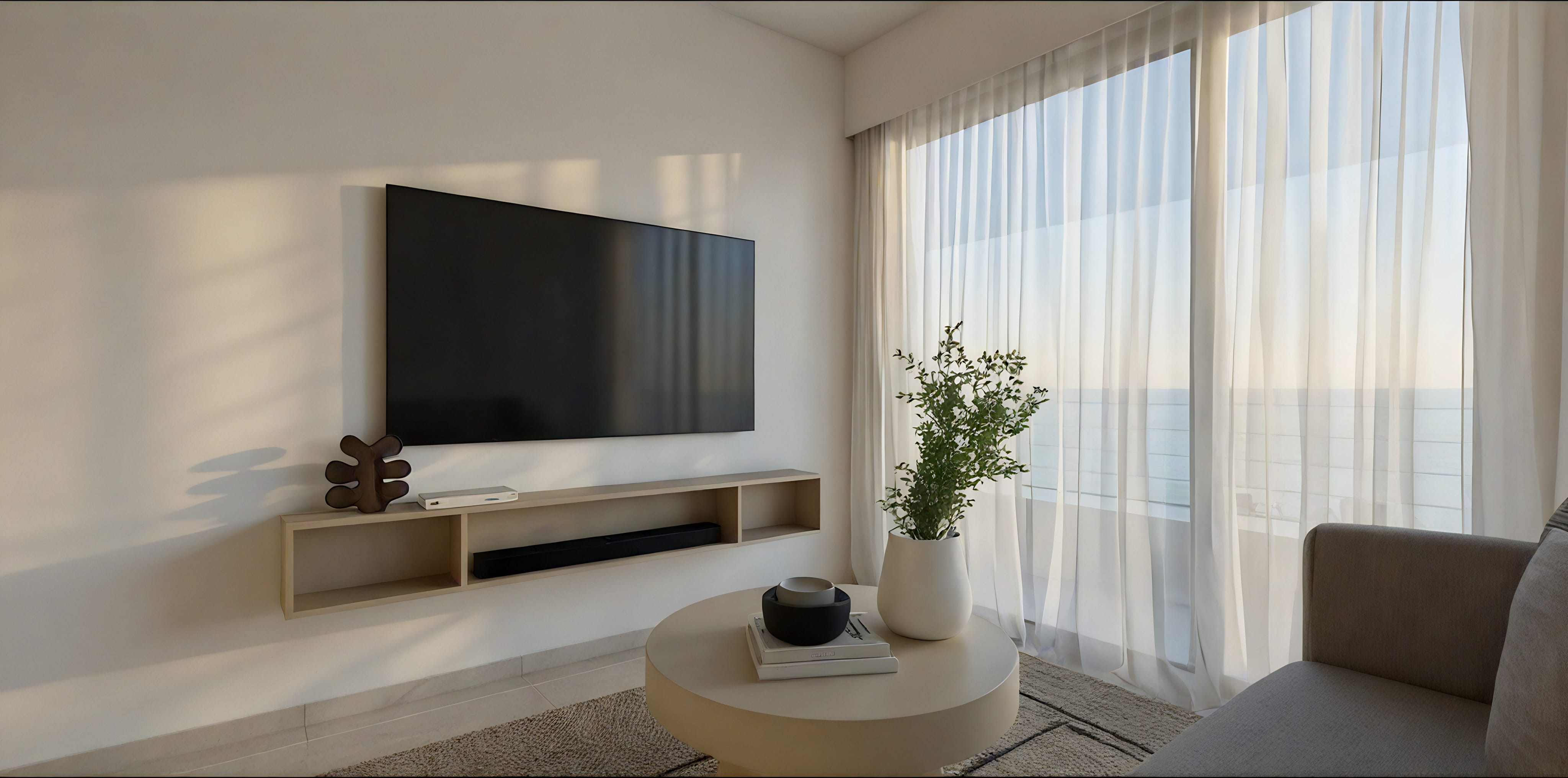 a room with a tv and a table with plants on it