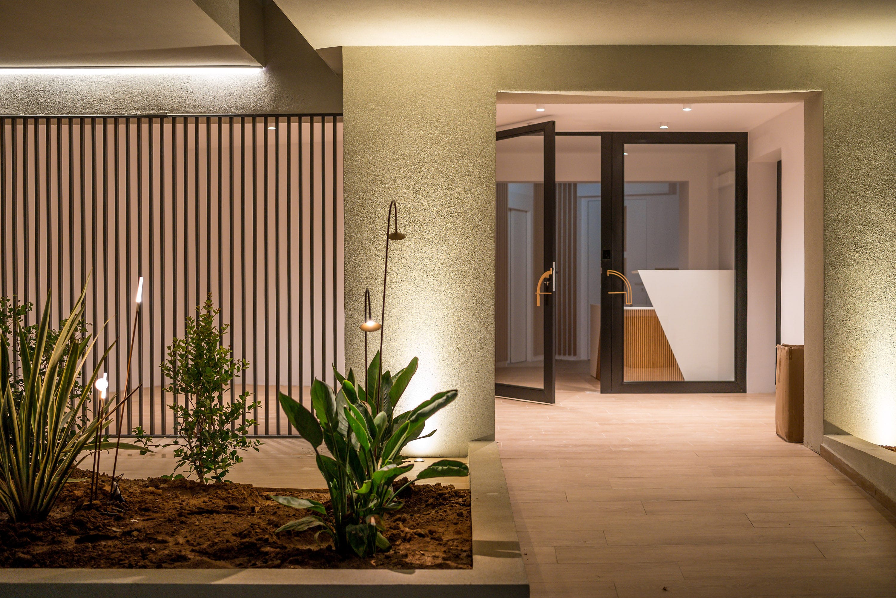 a hallway with a plant