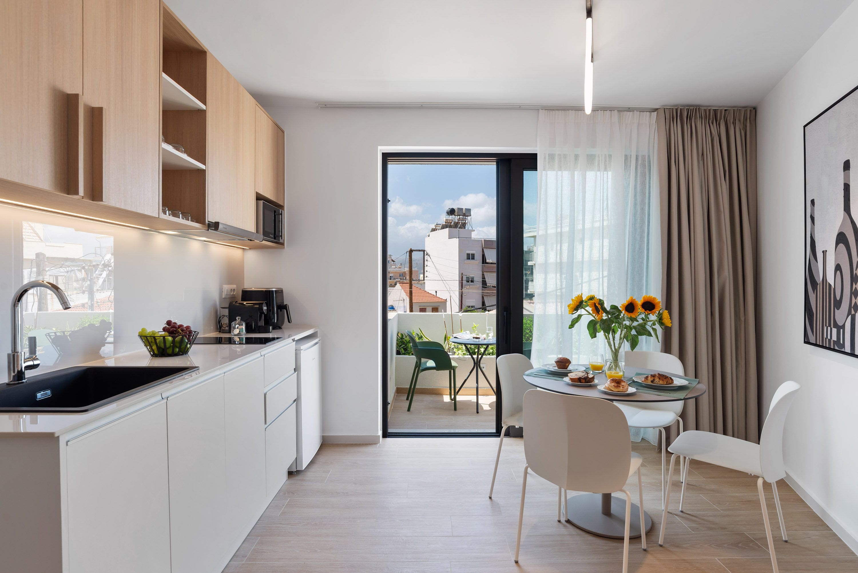 a kitchen with a dining table and chairs