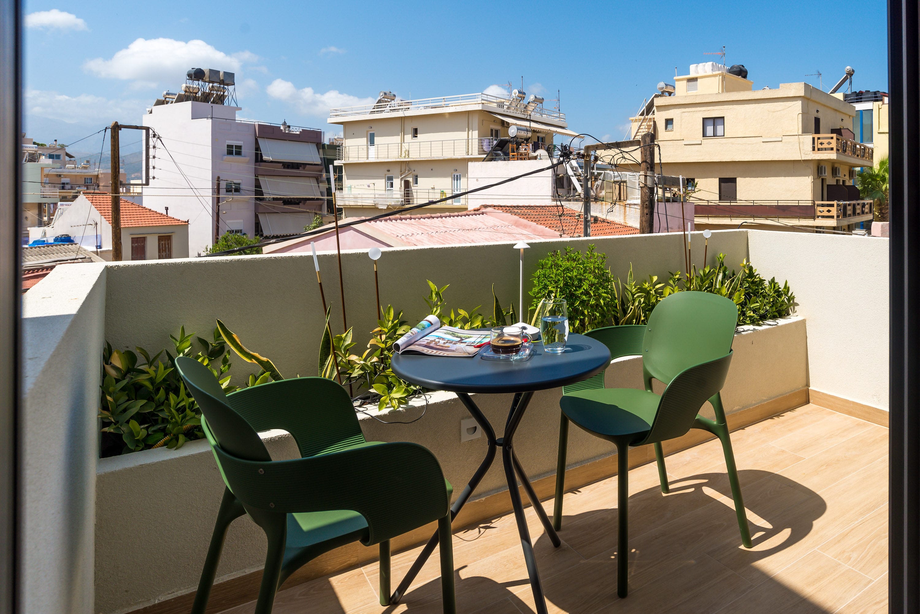 a table and chairs on a balcony