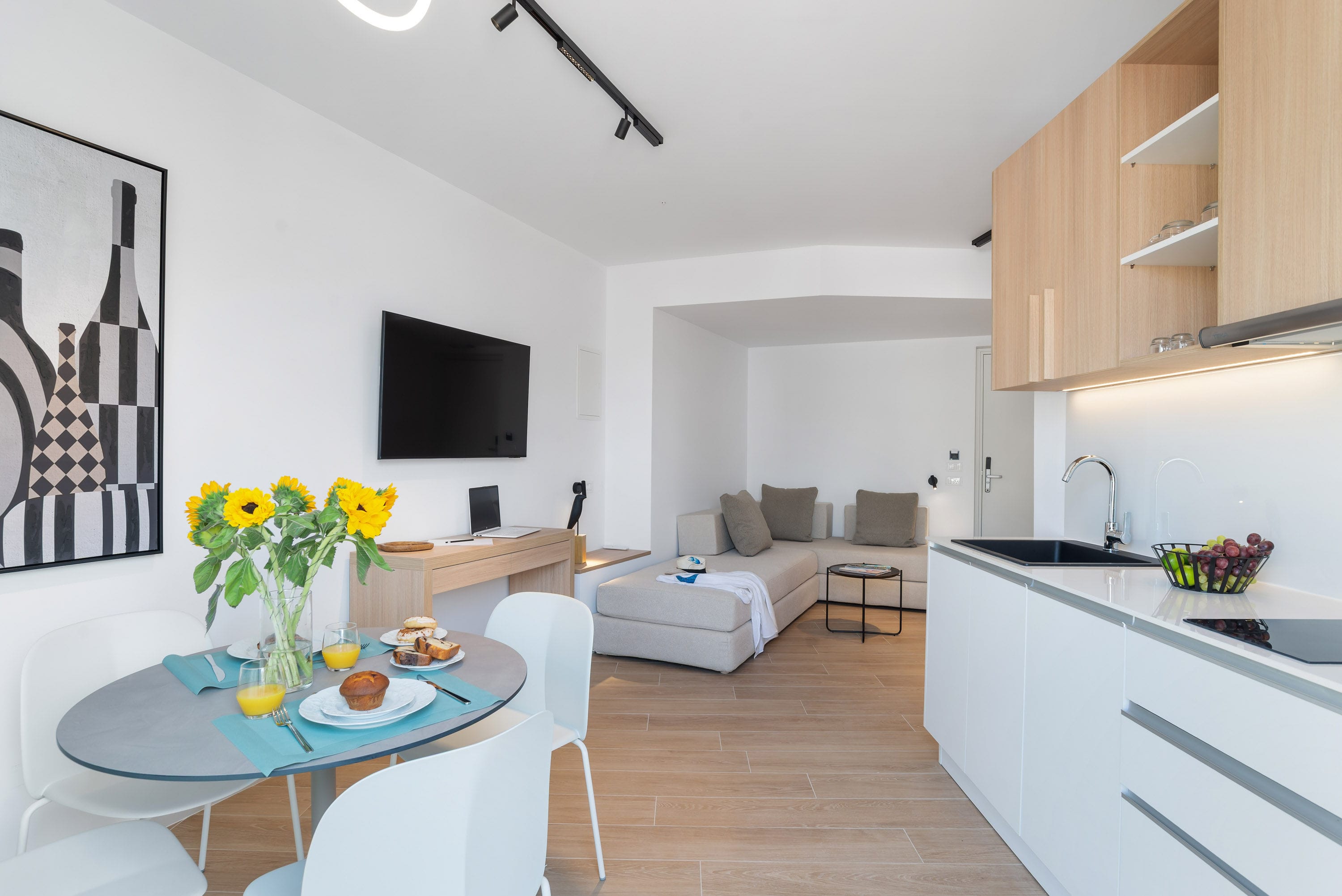 a living room with a tv and couches